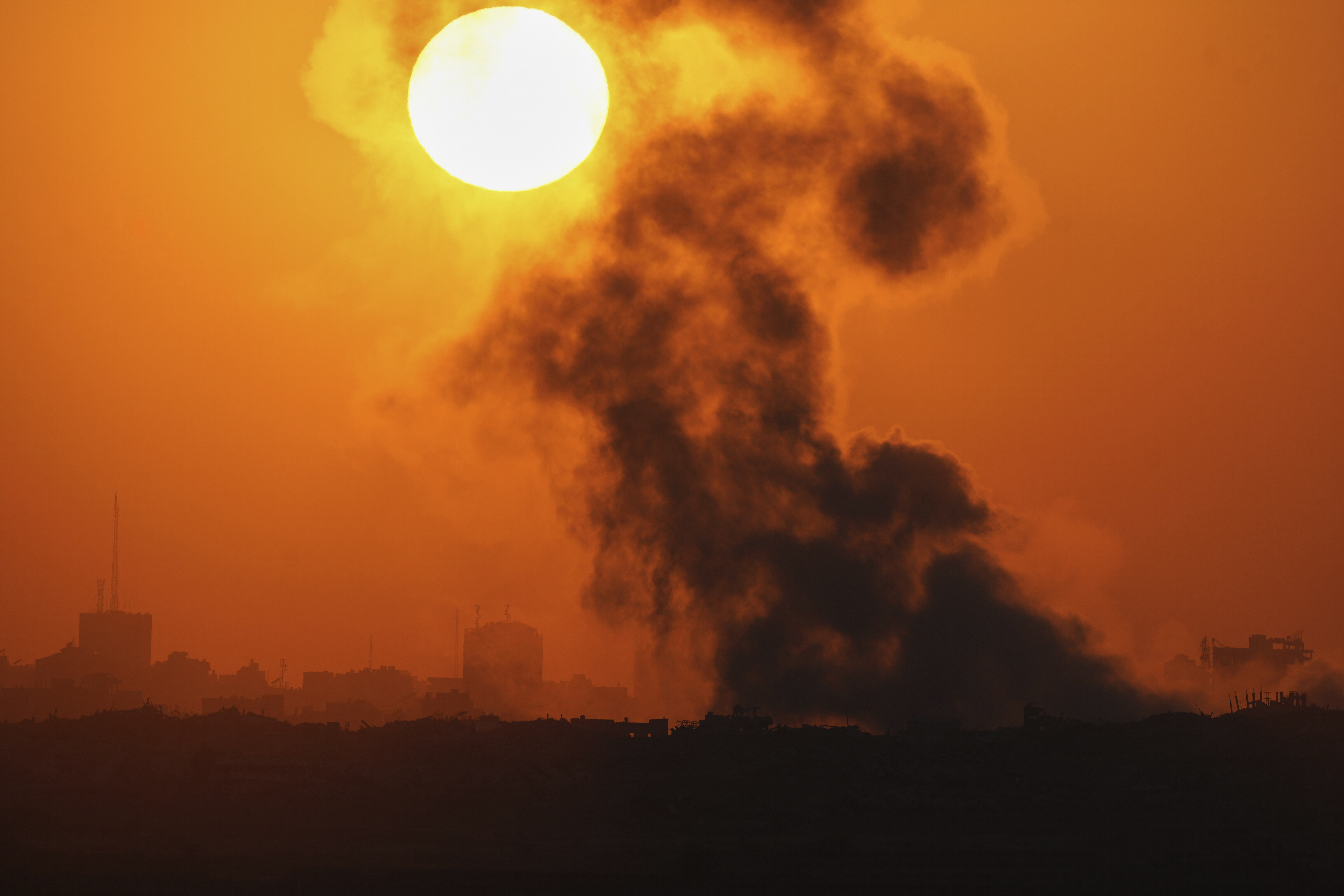 Smoke billows from an explosion in the northern Gaza Strip, as seen from southern Israel Wednesday, July 23, 2025. (AP Photo/Ohad Zwigenberg)
