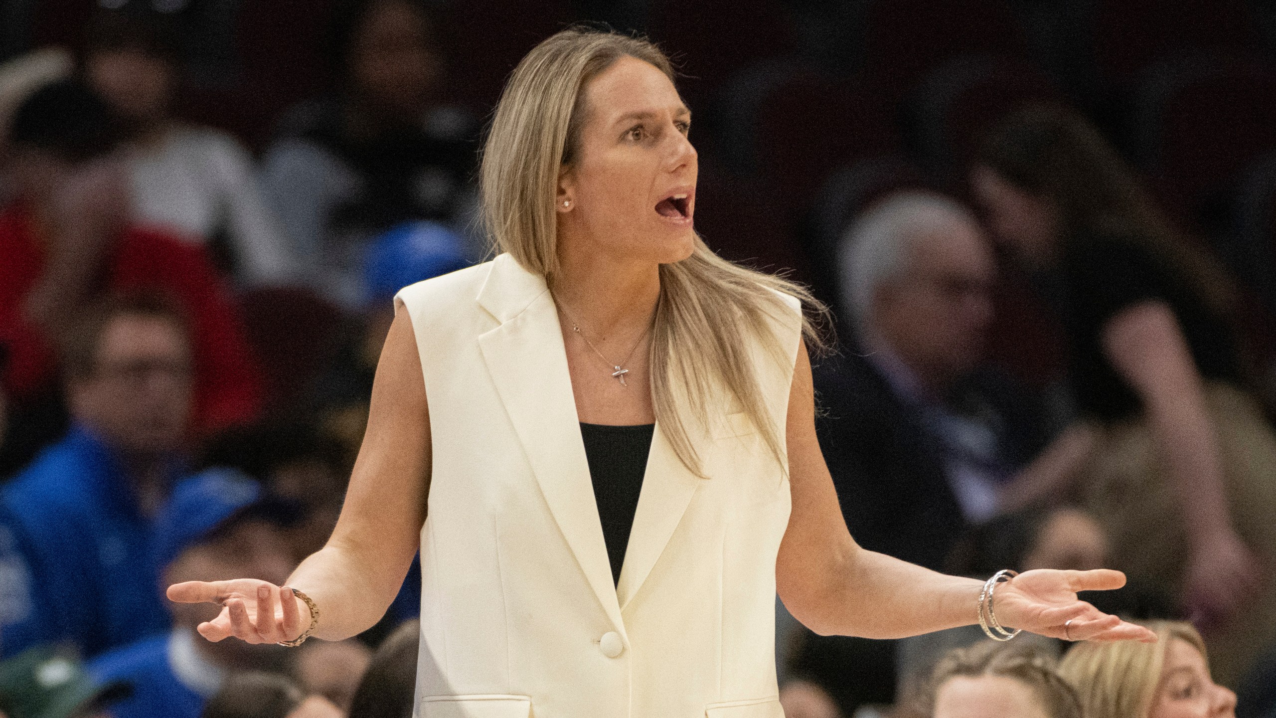 FILE - Buffalo's head coach Becky Burke reacts to a referee's call during the first half of an NCAA college basketball college game against Kent State in the championship of the Mid-American Conference tournament in Cleveland, March 16, 2024. (AP Photo/Phil Long, file)