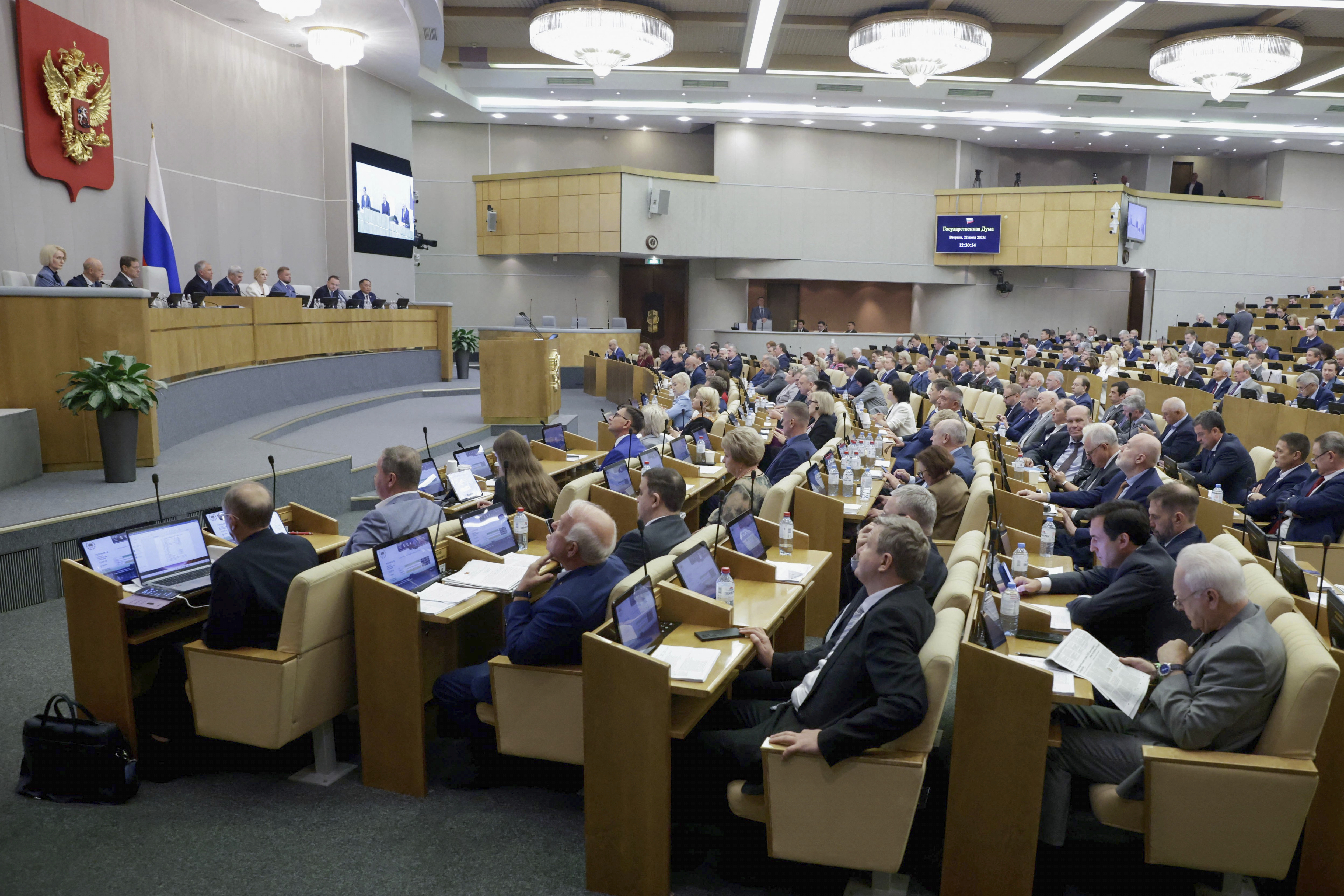 In this photo released by the State Duma, deputies attend a session at the State Duma, the lower house of the Russian parliament, in Moscow, Russia, Tuesday, July 22, 2025. (The State Duma, Lower House of the Russian Parliament Press Service via AP)