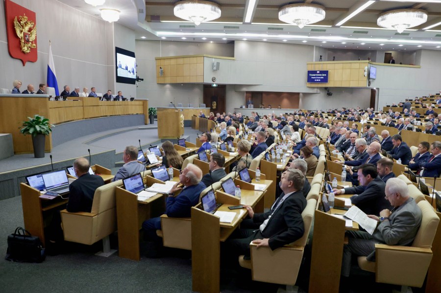 In this photo released by the State Duma, deputies attend a session at the State Duma, the lower house of the Russian parliament, in Moscow, Russia, Tuesday, July 22, 2025. (The State Duma, Lower House of the Russian Parliament Press Service via AP)