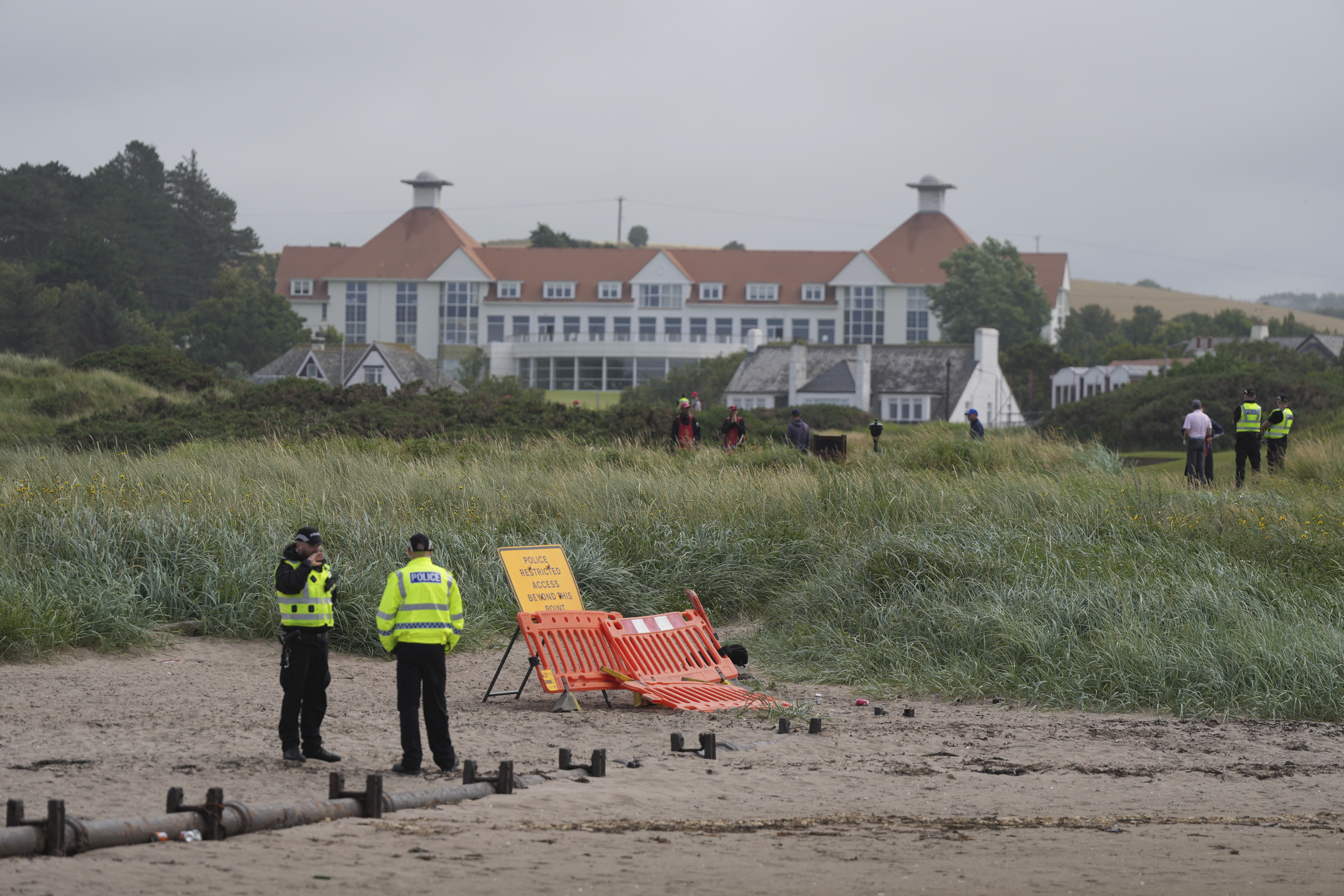 Police guard the Trump Turnberry golf course in Turnberry, Scotland, Friday, July 25, 2025, ahead of President Trump's visit Scotland. (AP Photo/Alastair Grant)