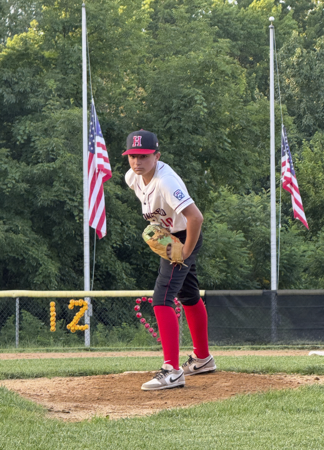 In this undated photo provided by Joseph Rocco, his son Marco Rocco prepares to deliver a pitch in a baseball game in Haddonfield, N.J. (Family courtesy photo via AP)