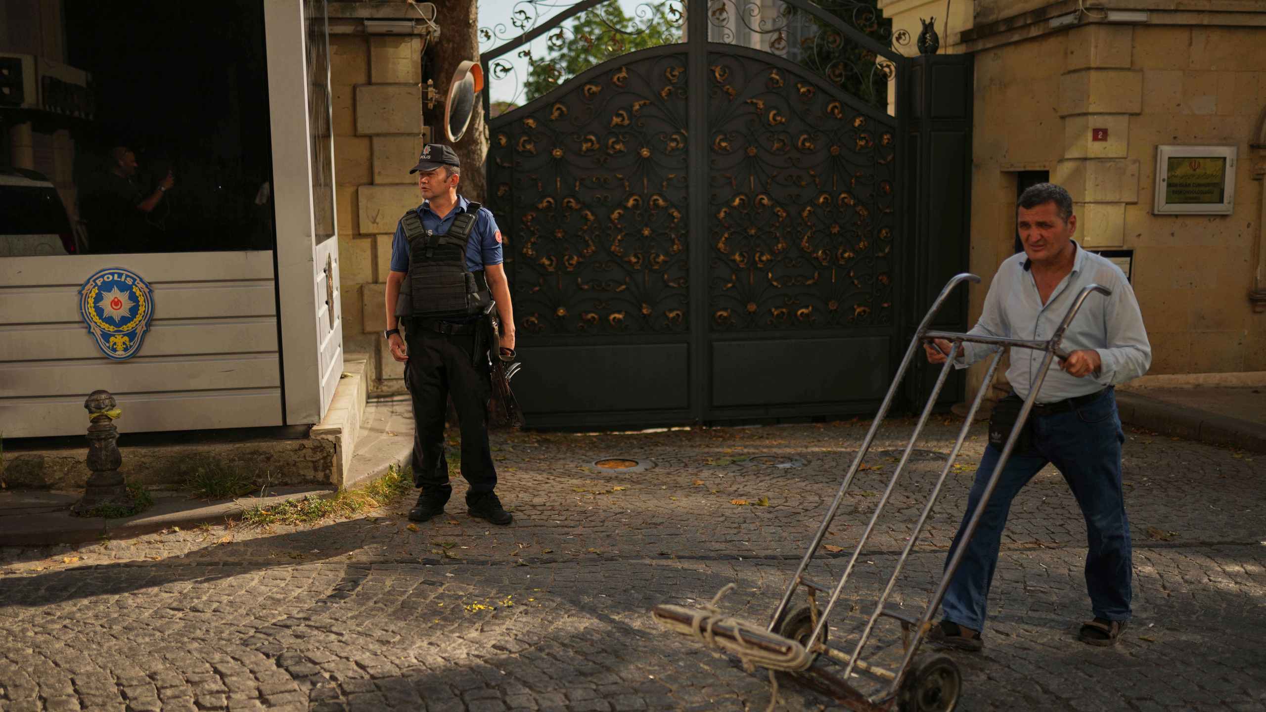 A policeman stands guard outside of the Iranian consulate as European and Iranian diplomats meet for talks over Tehran's nuclear program, in Istanbul, Turkey, Friday, July 25, 2025. (AP Photo/Francisco Seco)