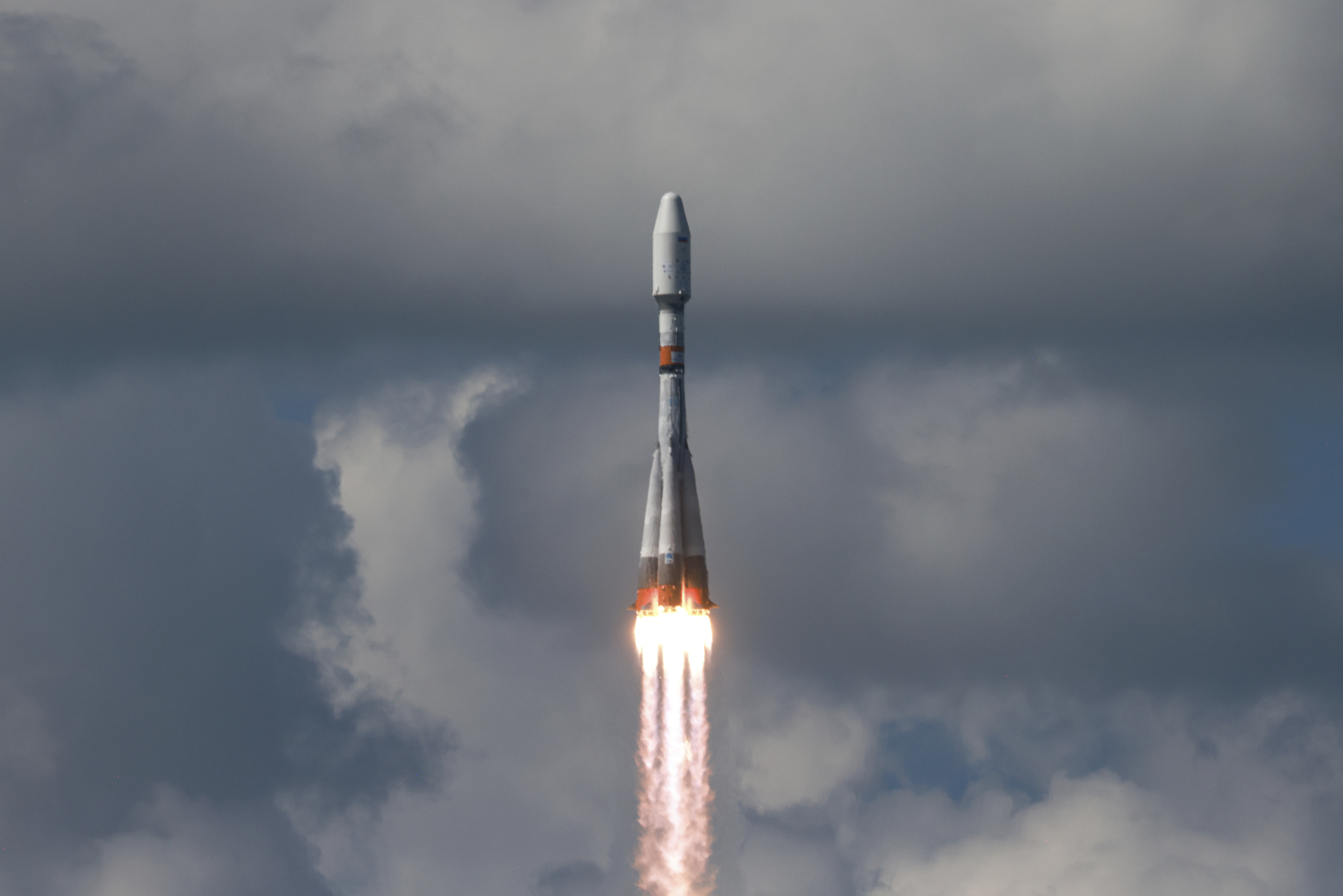 In this photo released by Roscosmos State Space Corporate on Friday, July 25, 2025, a Soyuz rocket lifts off from a launch site in Vostochny in far eastern Russia carrying an Iranian satellite along with Russian satellites into orbit. (Roscosmos State Space Corporate via AP)