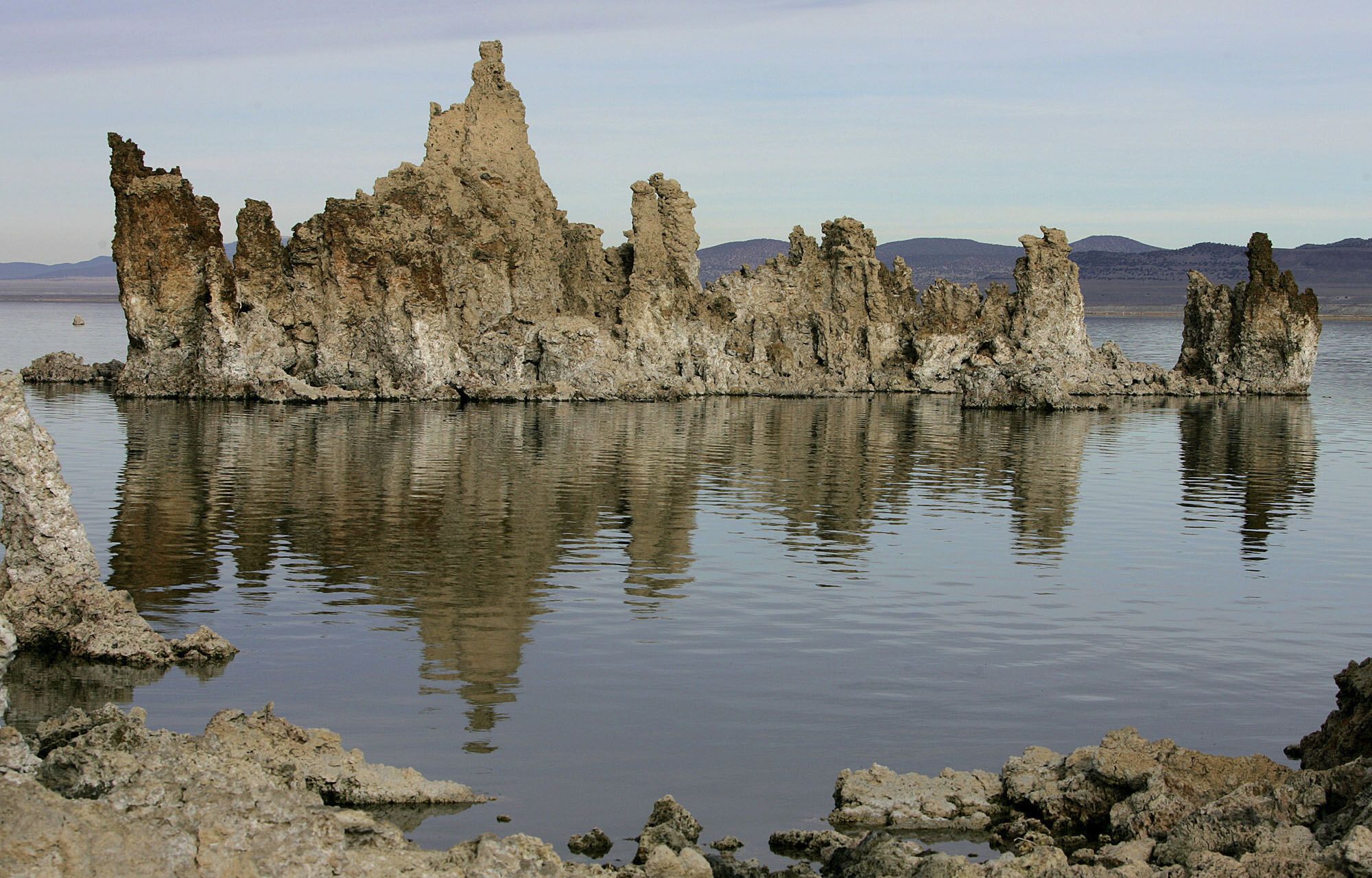 FILE - Tufa towers are reflected in Mono Lake near Lee Vining, Calif., Nov. 15, 2004. (AP Photo/Ben Margot, File)