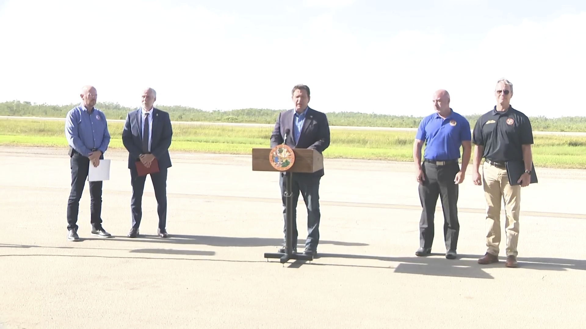 This image from a video feed shows Gov. Ron DeSantis speaking about deportation flights from the remote Everglades immigration lockup known as ”Alligator Alcatraz″ on July 25, 2025 in Ochopee, Florida. (Office Of Florida Governor Ron Desantis via AP)
