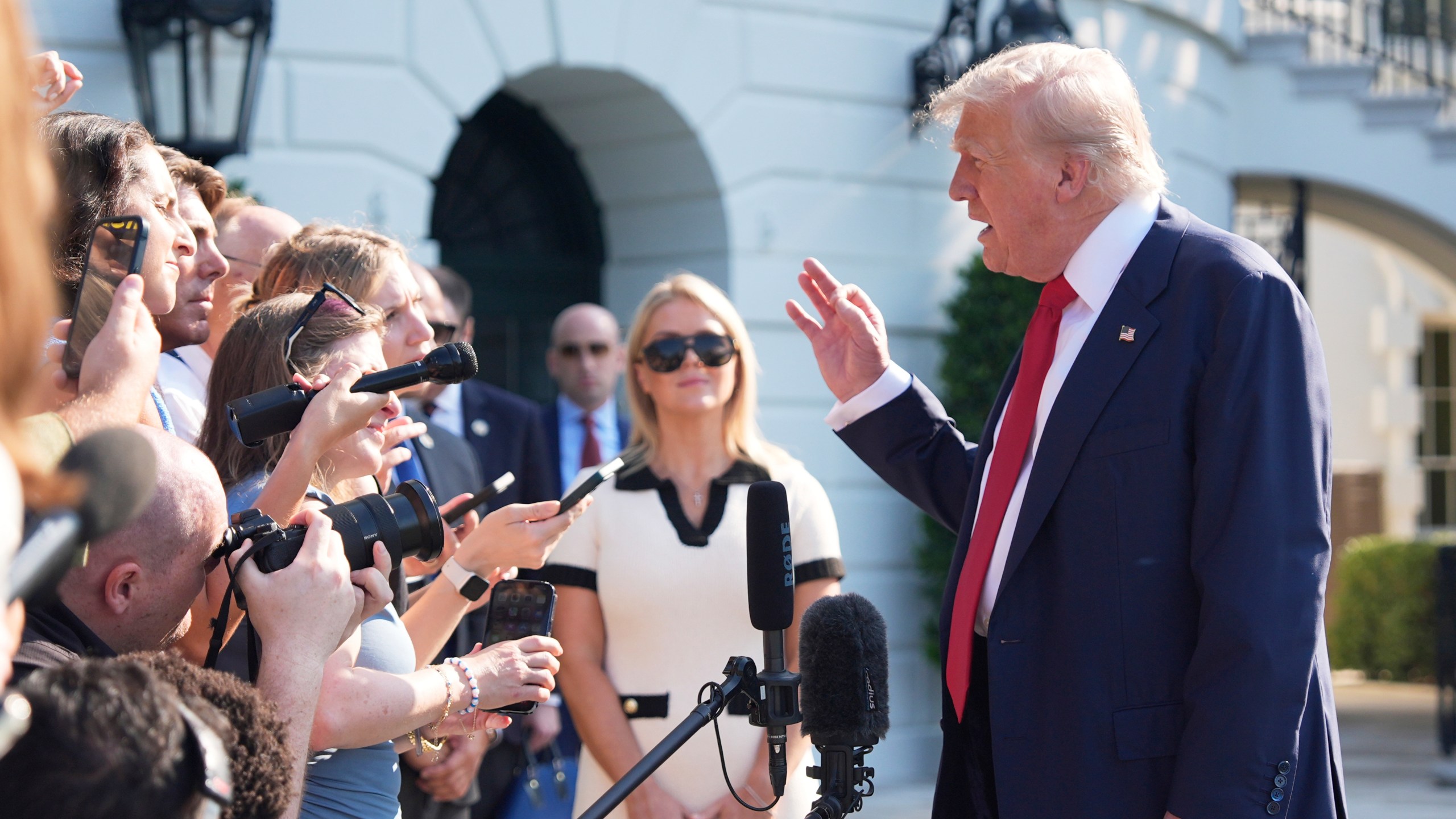 President Donald Trump speaks with reporters before departing on Marine One from the South Lawn of the White House, Friday, July 25, 2025, in Washington. The President is traveling to Scotland. (AP Photo/Alex Brandon)