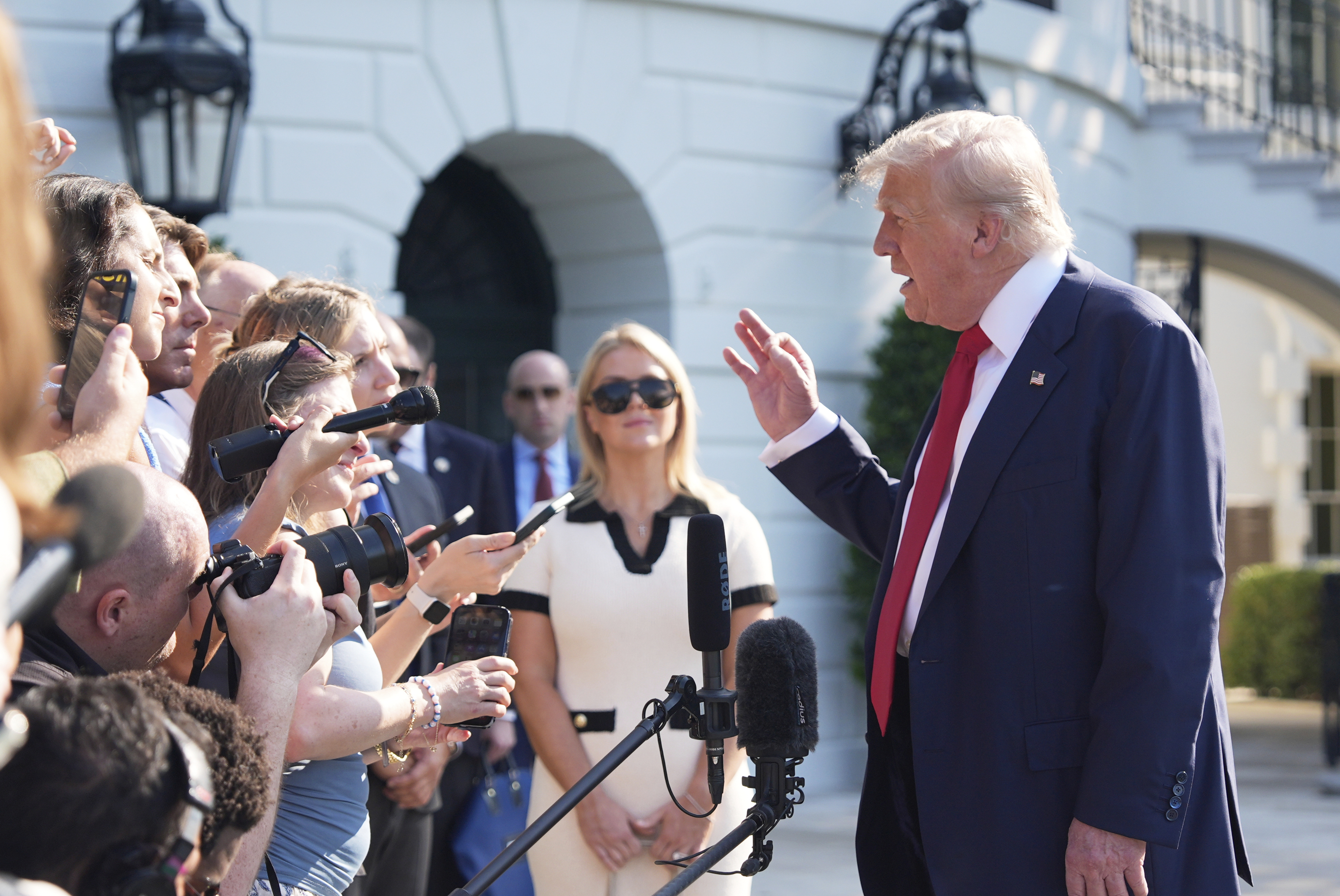 President Donald Trump speaks with reporters before departing on Marine One from the South Lawn of the White House, Friday, July 25, 2025, in Washington. The President is traveling to Scotland. (AP Photo/Alex Brandon)