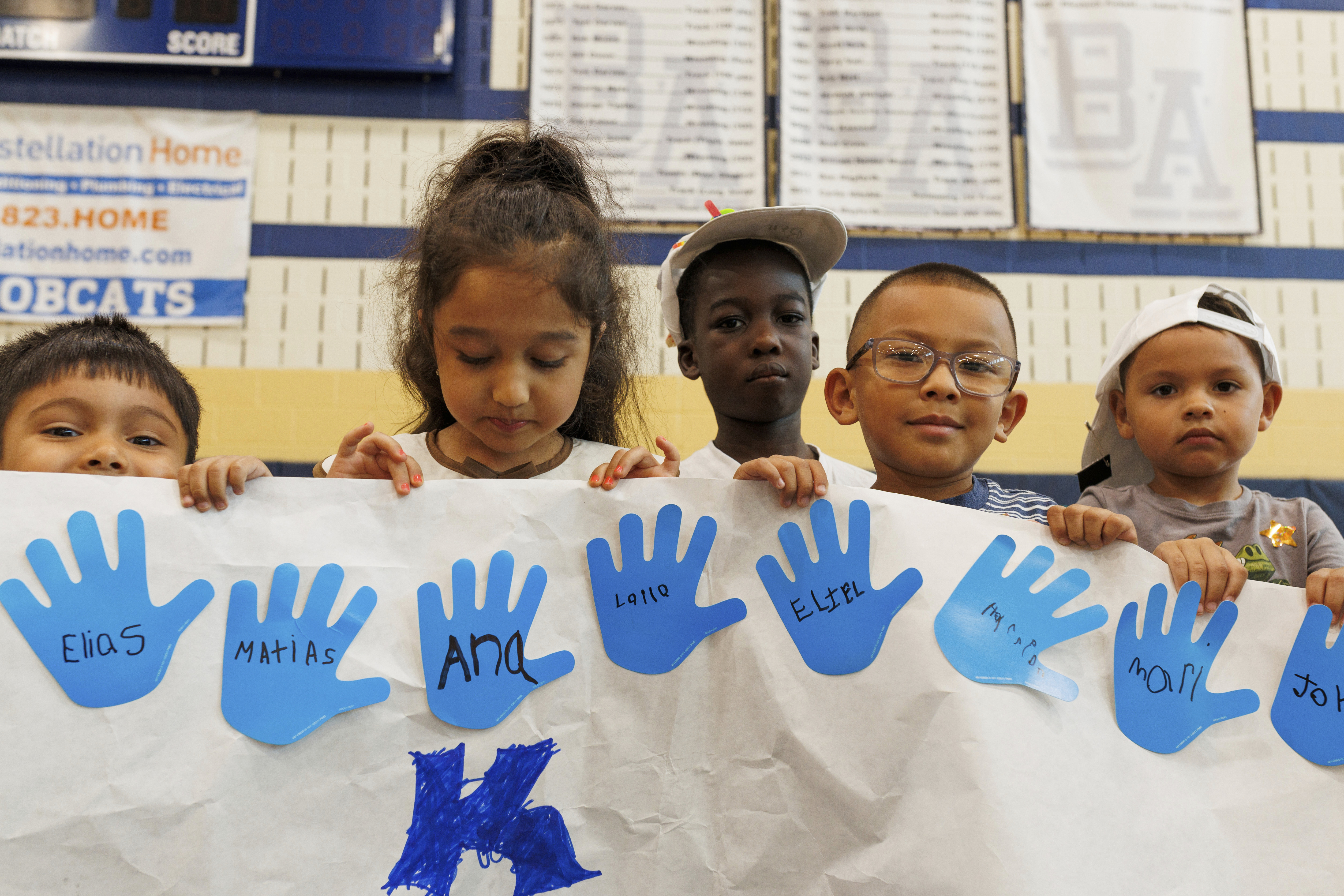 LASOS summer campers hold up an art project at Bel Air High School in Bel Air, Md., on Thursday, July 24, 2025. (AP Photo/KT Kanazawich)