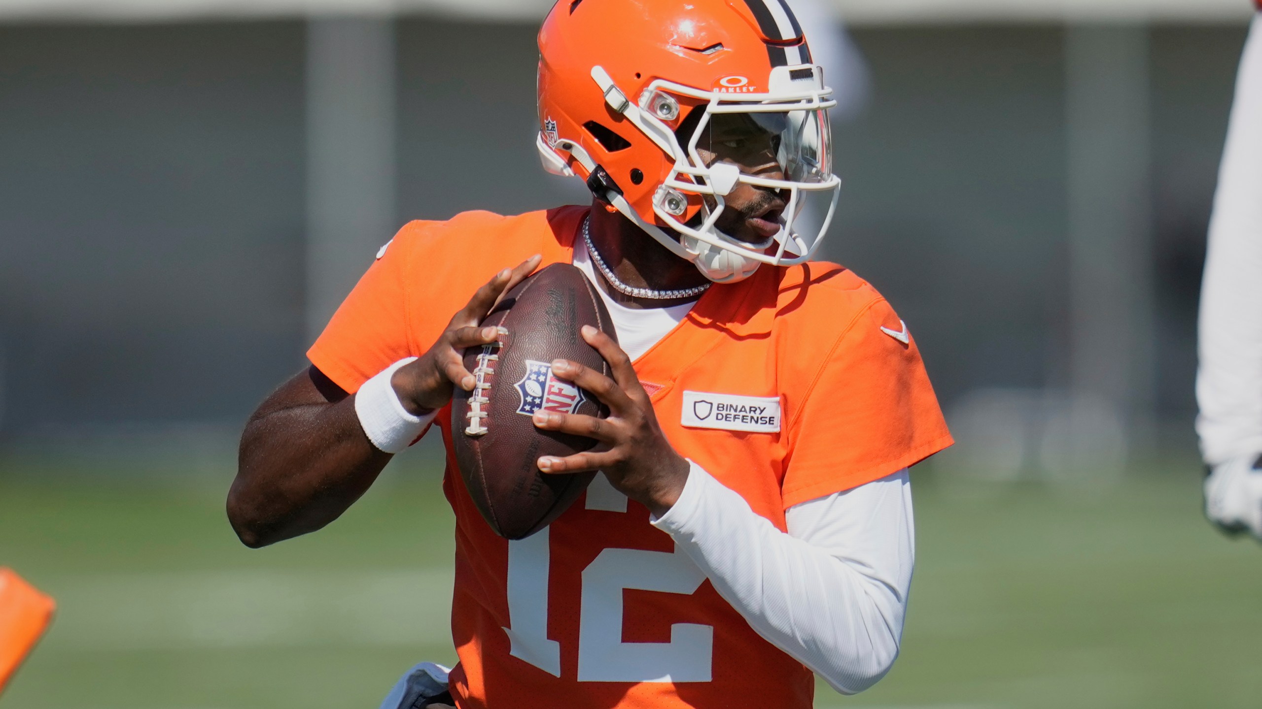 Cleveland Browns quarterback Shedeur Sanders (12) throws during a practice at the team's NFL football training camp Wednesday, July 23, 2025, in Berea, Ohio. (AP Photo/Sue Ogrocki)
