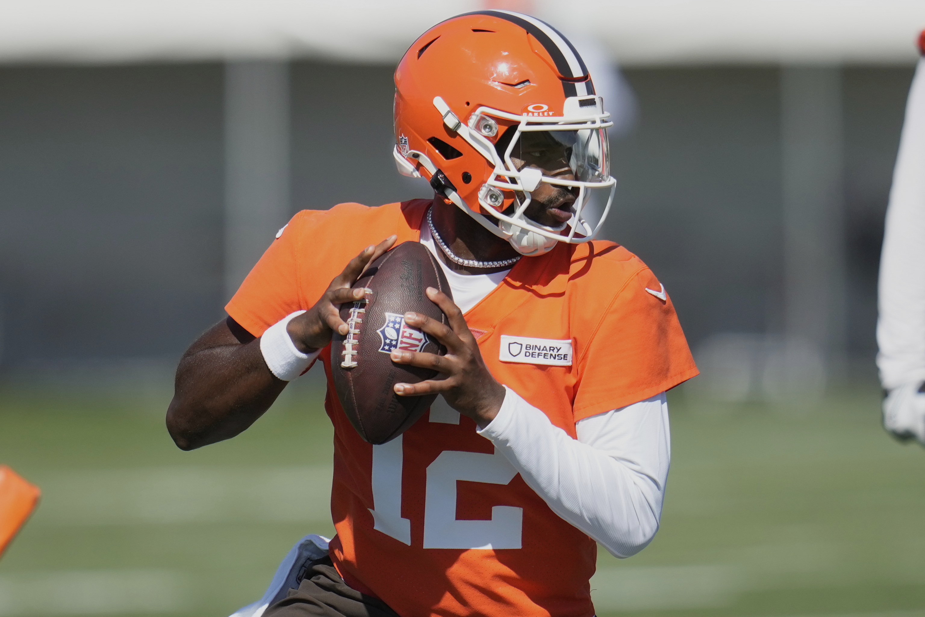 Cleveland Browns quarterback Shedeur Sanders (12) throws during a practice at the team's NFL football training camp Wednesday, July 23, 2025, in Berea, Ohio. (AP Photo/Sue Ogrocki)