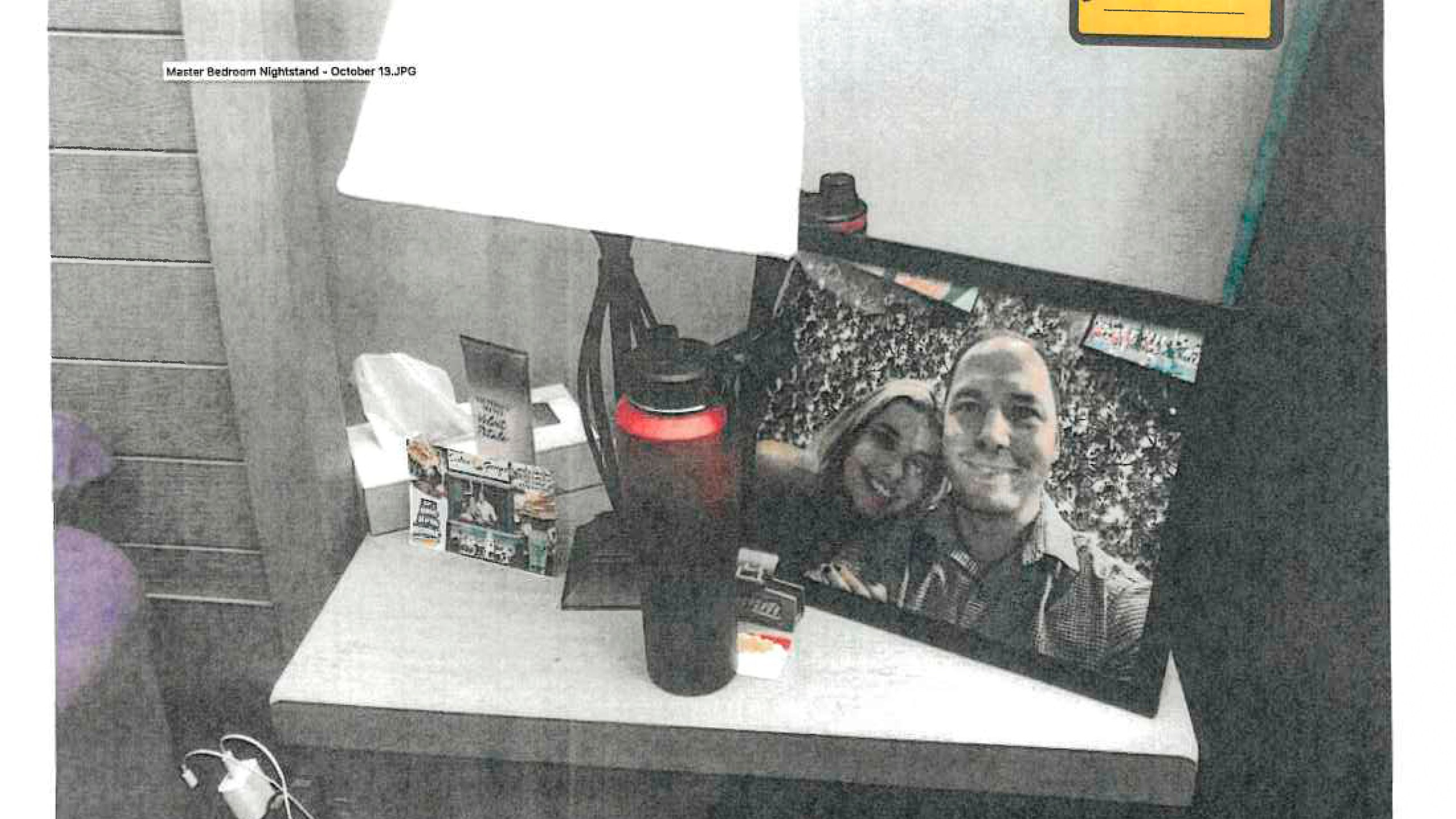 FILE - This image provided by the Fairfax County Police Department and taken on Oct. 13, 2023, was submitted as evidence in the murder case against Brendan Banfield shows a framed photo of Banfield and Juliana Peres Magalhães on his bedside table in Herndon, Va. (Fairfax County Police Department via AP, FILE)