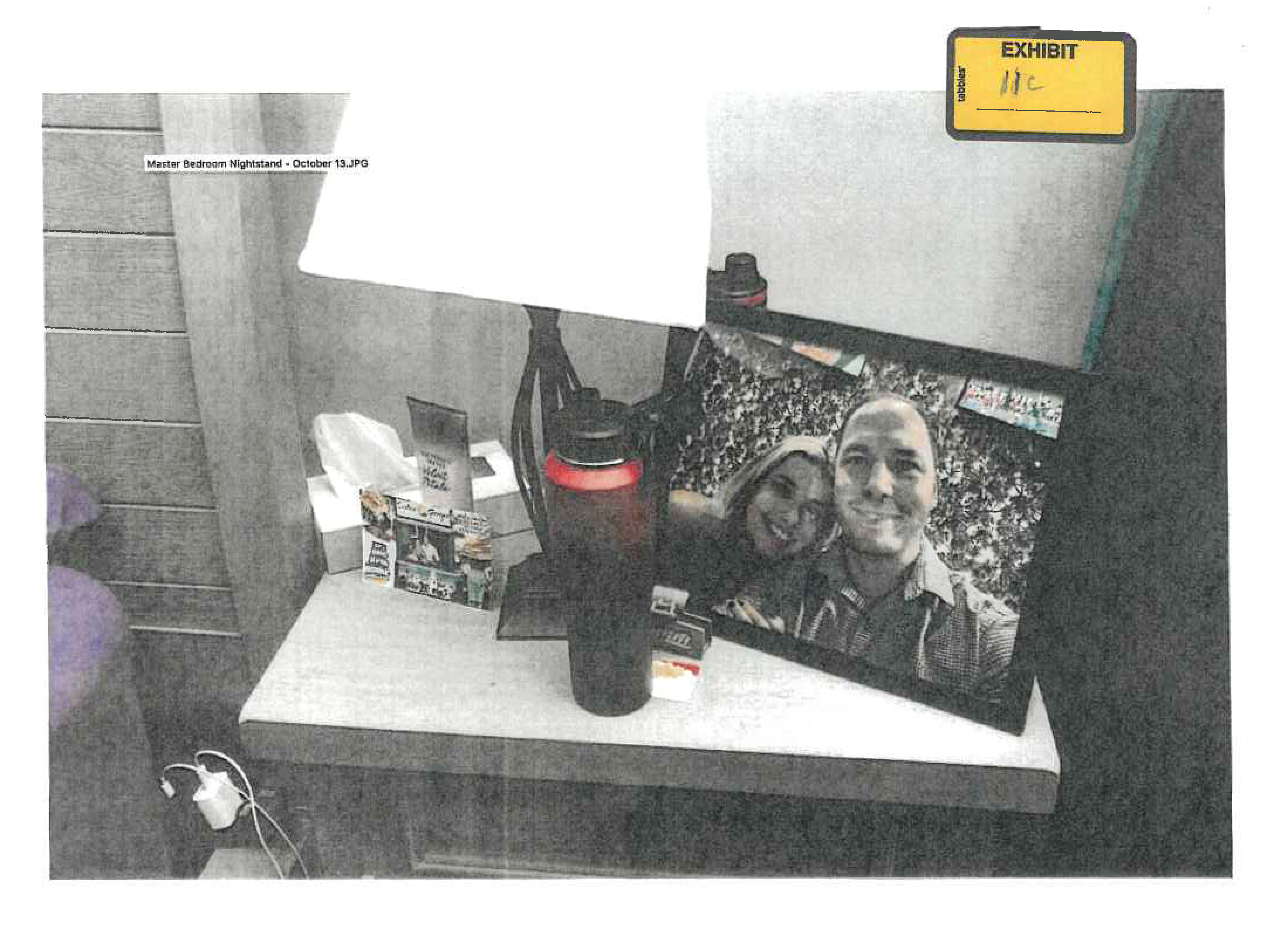 FILE - This image provided by the Fairfax County Police Department and taken on Oct. 13, 2023, was submitted as evidence in the murder case against Brendan Banfield shows a framed photo of Banfield and Juliana Peres Magalhães on his bedside table in Herndon, Va. (Fairfax County Police Department via AP, FILE)