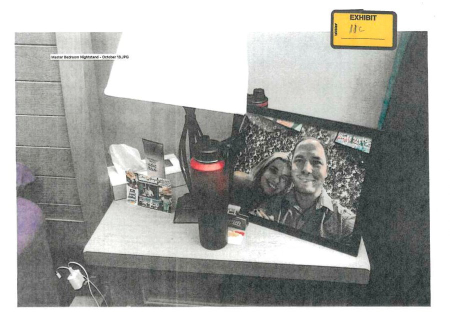 FILE - This image provided by the Fairfax County Police Department and taken on Oct. 13, 2023, was submitted as evidence in the murder case against Brendan Banfield shows a framed photo of Banfield and Juliana Peres Magalhães on his bedside table in Herndon, Va. (Fairfax County Police Department via AP, FILE)