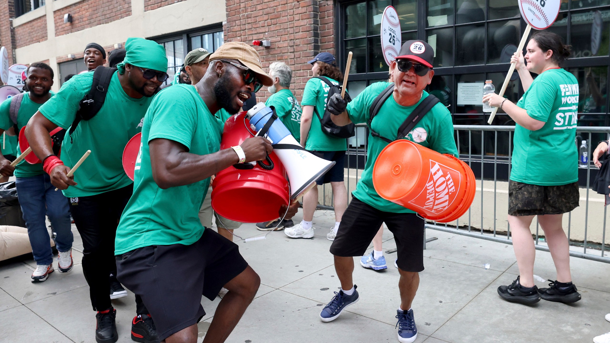 Concession workers from Fenway Park picket outside the ballpark Friday, July 25, 2025, in Boston before a baseball game between the Boston Red Sox and the Los Angeles Dodgers. (AP Photo/Mark Stockwell)