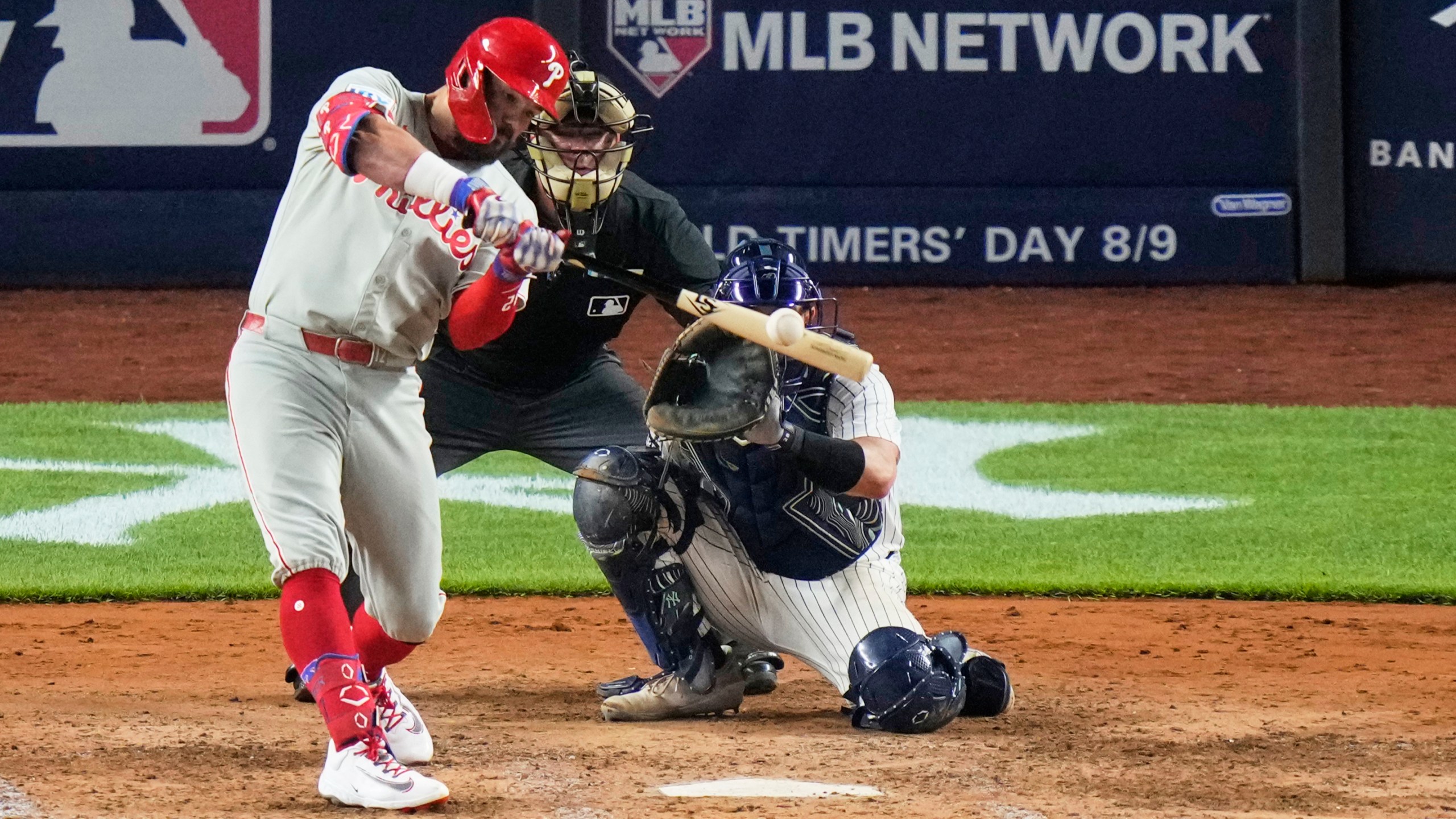 Philadelphia Phillies' Kyle Schwarber hits a two-run home run during the eighth inning of a baseball game against the New York Yankees Friday, July 25, 2025, in New York. (AP Photo/Frank Franklin II)