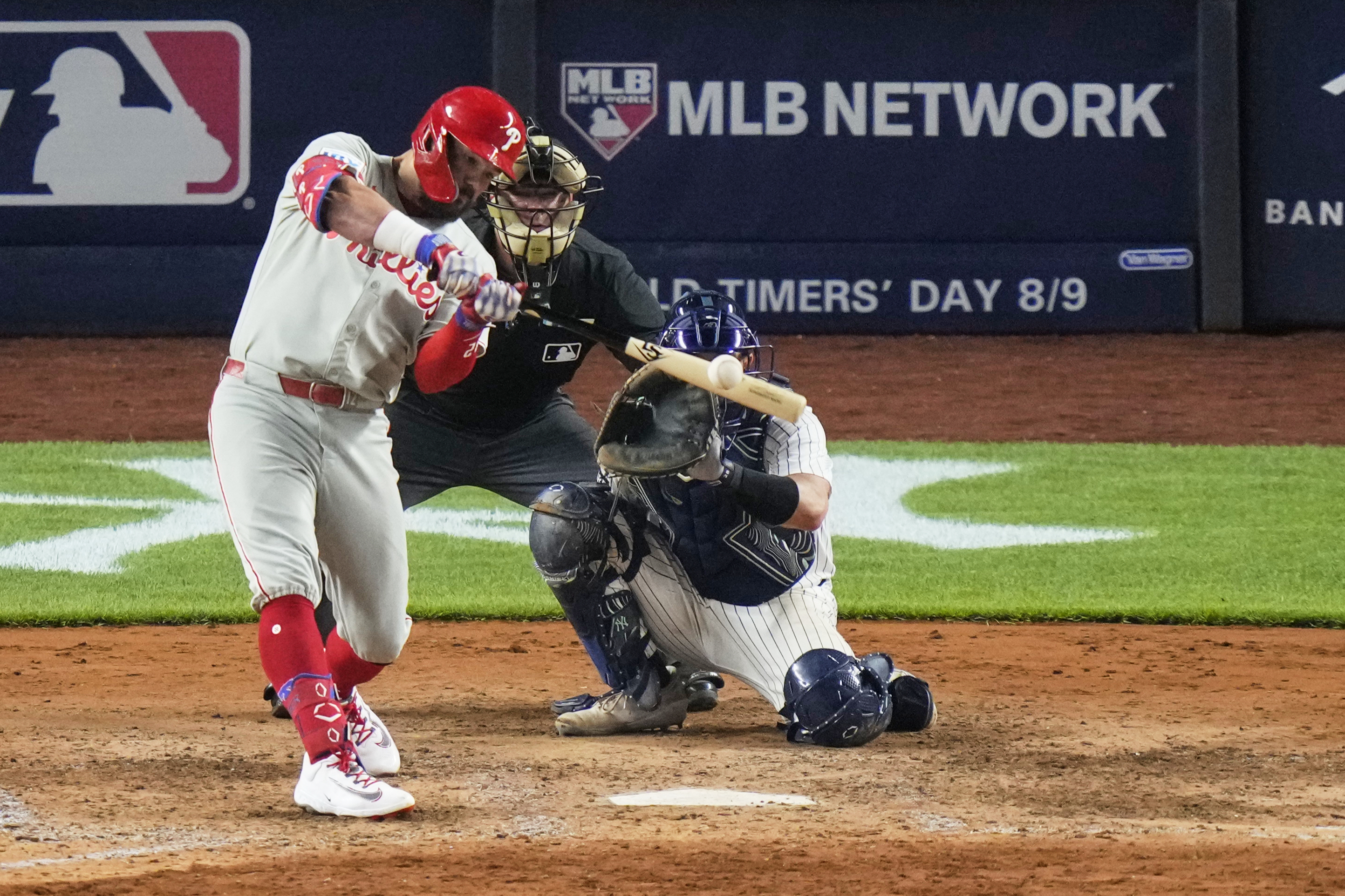 Philadelphia Phillies' Kyle Schwarber hits a two-run home run during the eighth inning of a baseball game against the New York Yankees Friday, July 25, 2025, in New York. (AP Photo/Frank Franklin II)