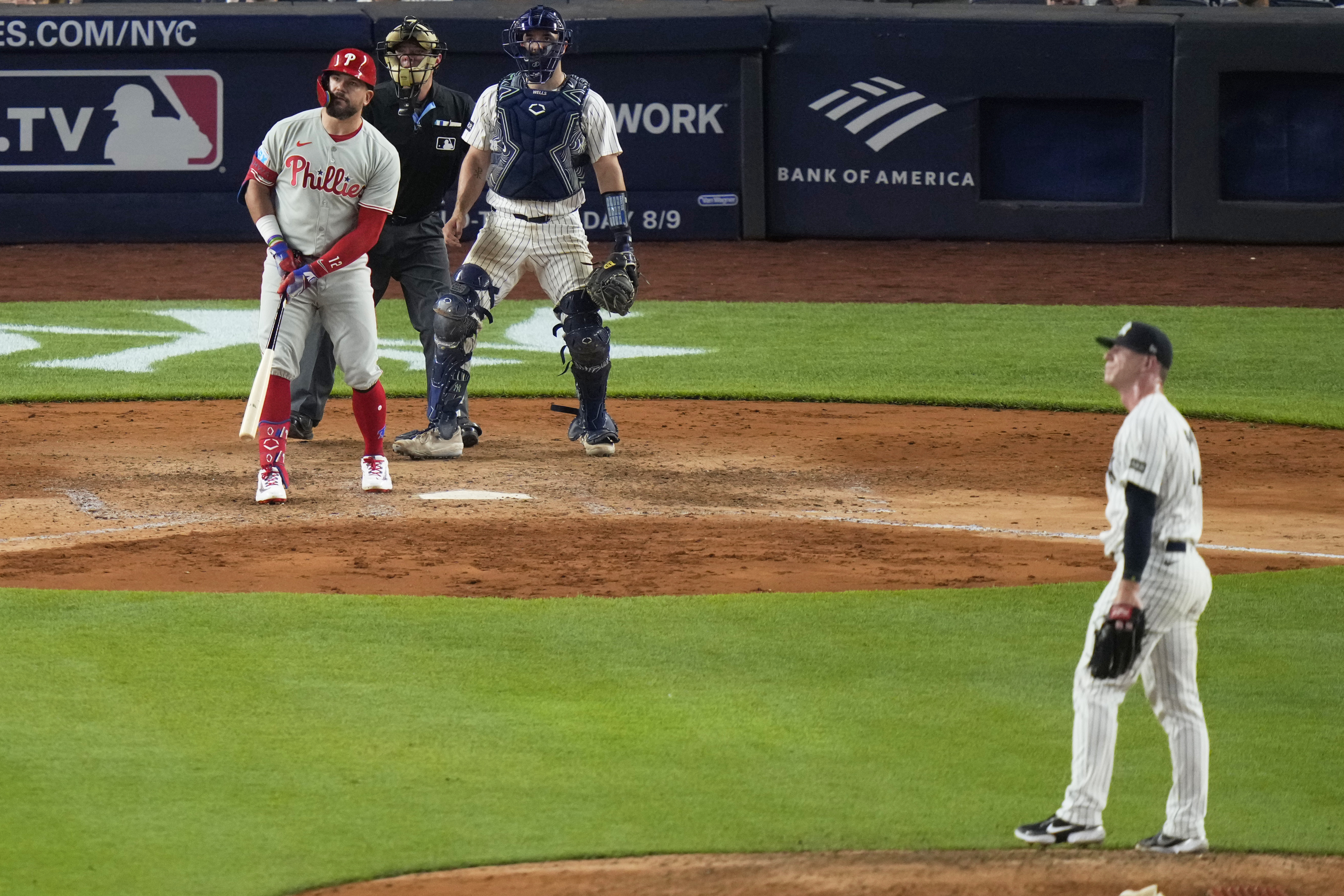 New York Yankees pitcher Ian Hamilton and catcher Austin Wells watch a ball hit by Philadelphia Phillies' Kyle Schwarber for a two-run home run during the eighth inning of a baseball game Friday, July 25, 2025, in New York. (AP Photo/Frank Franklin II)