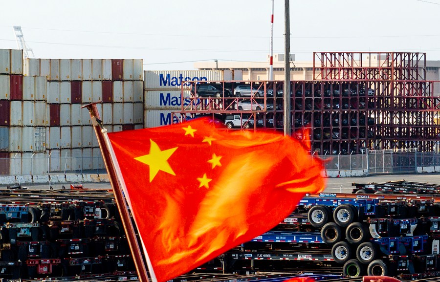 FILE - A Chinese flag flies from a ship at the Port of Oakland on Tuesday, April 15, 2025, in Oakland, Calif. (AP Photo/Noah Berger,File)