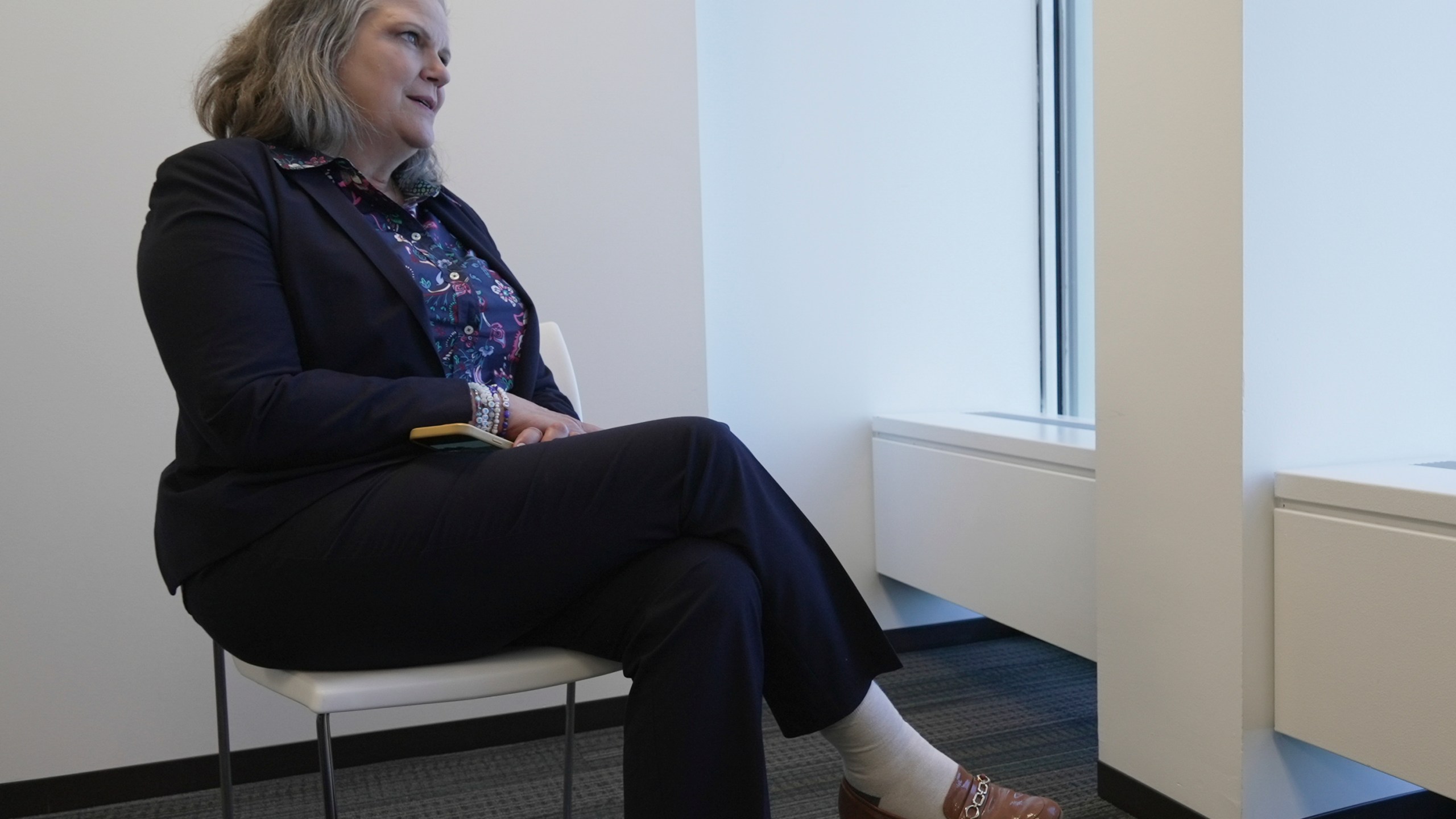 Jennifer Peyton sits for an interview in downtown Chicago on July 21, 2025. (AP Photo/Laura Bargfeld)