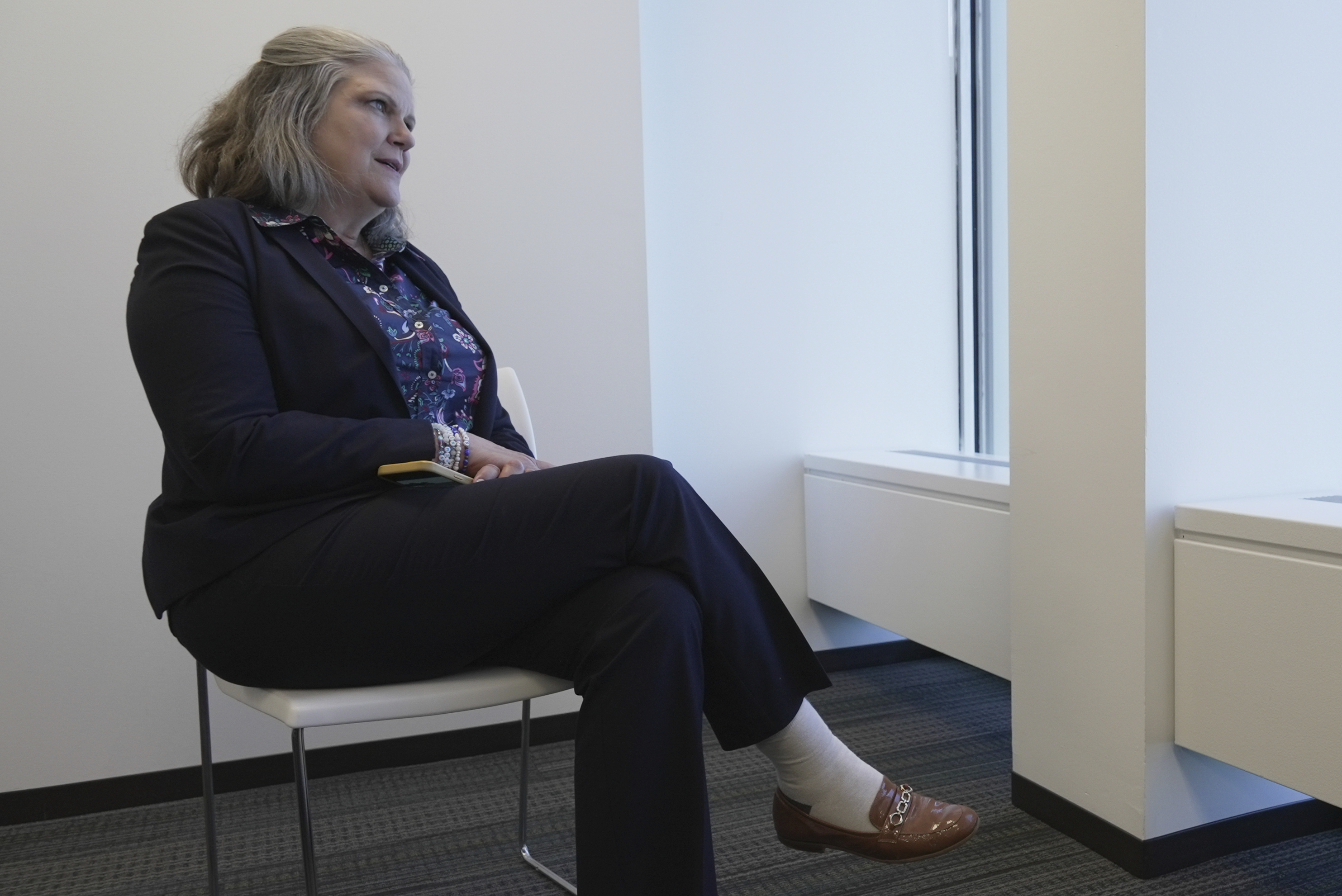 Jennifer Peyton sits for an interview in downtown Chicago on July 21, 2025. (AP Photo/Laura Bargfeld)