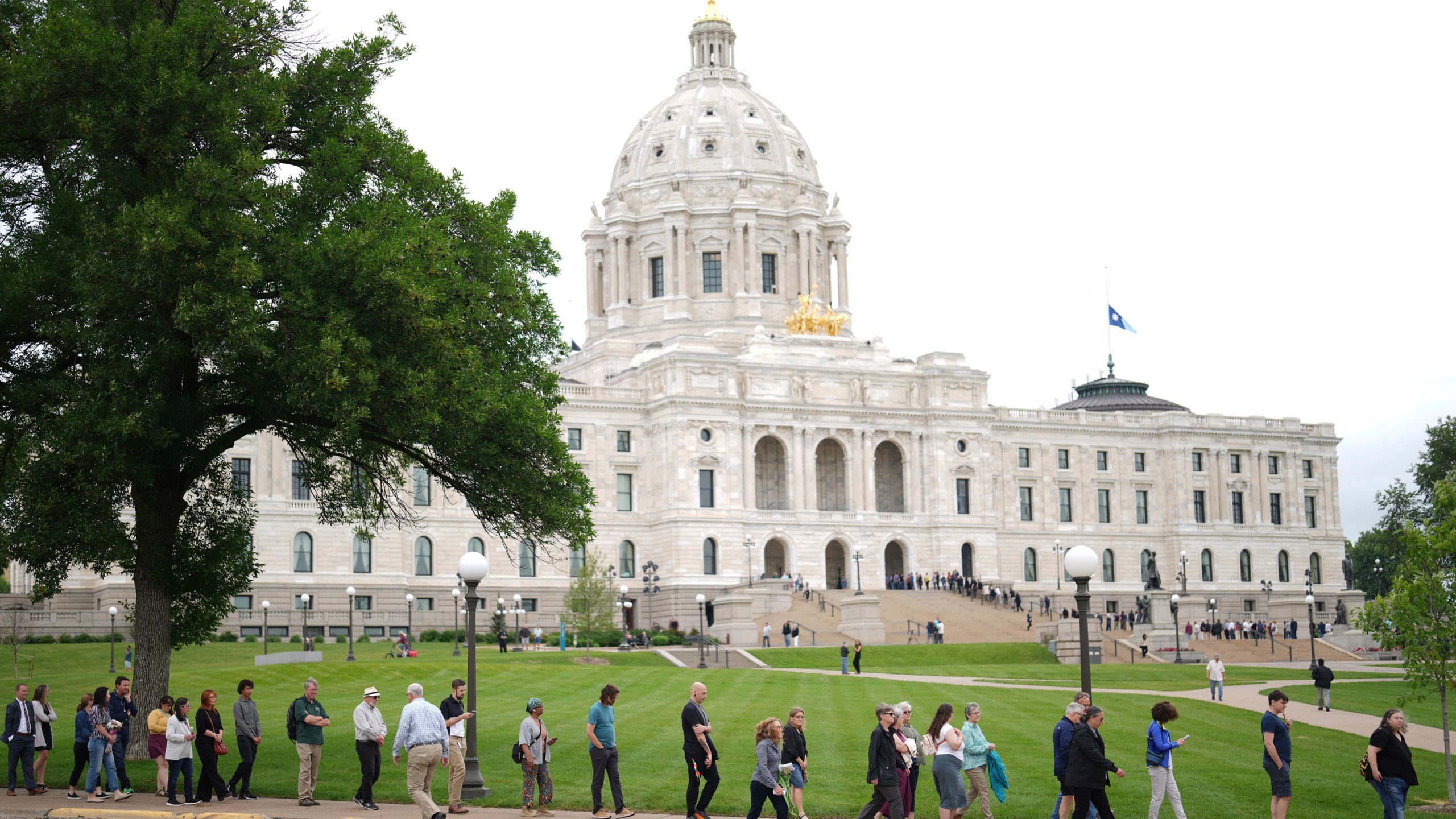 People wait in line to pay their respects to Minnesota state Rep. Melissa Hortman, her husband, Mark Hortman and their dog, Gilbert, at the Minnesota State Capitol in St. Paul, Minn., on Friday, June 27, 2025. (Alex Kormann/Star Tribune via AP)