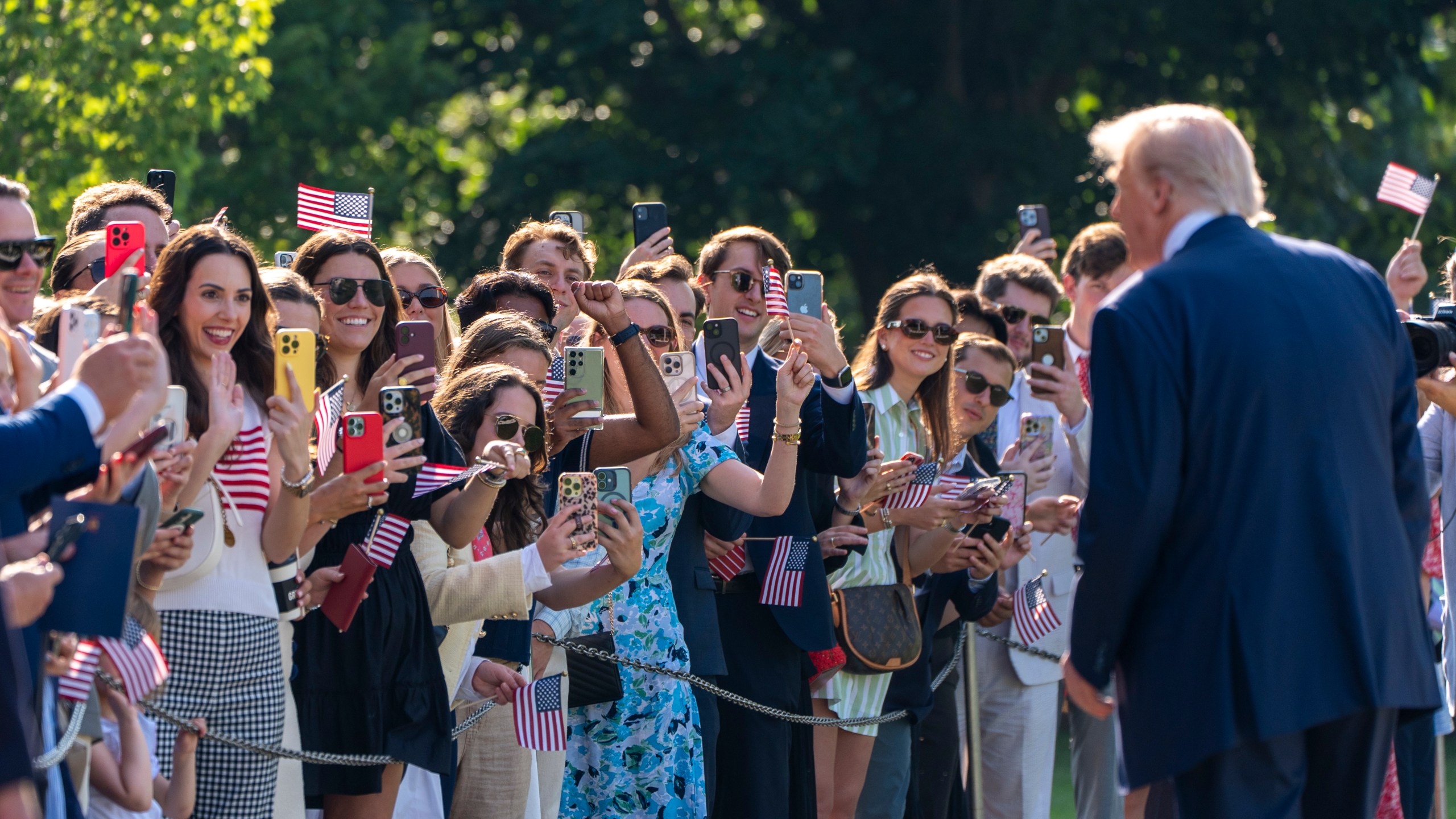 President Donald Trump speaks with supporters before departing on Marine One from the South Lawn of the White House, Friday, July 25, 2025, in Washington. The President is traveling to Scotland. (AP Photo/Alex Brandon)