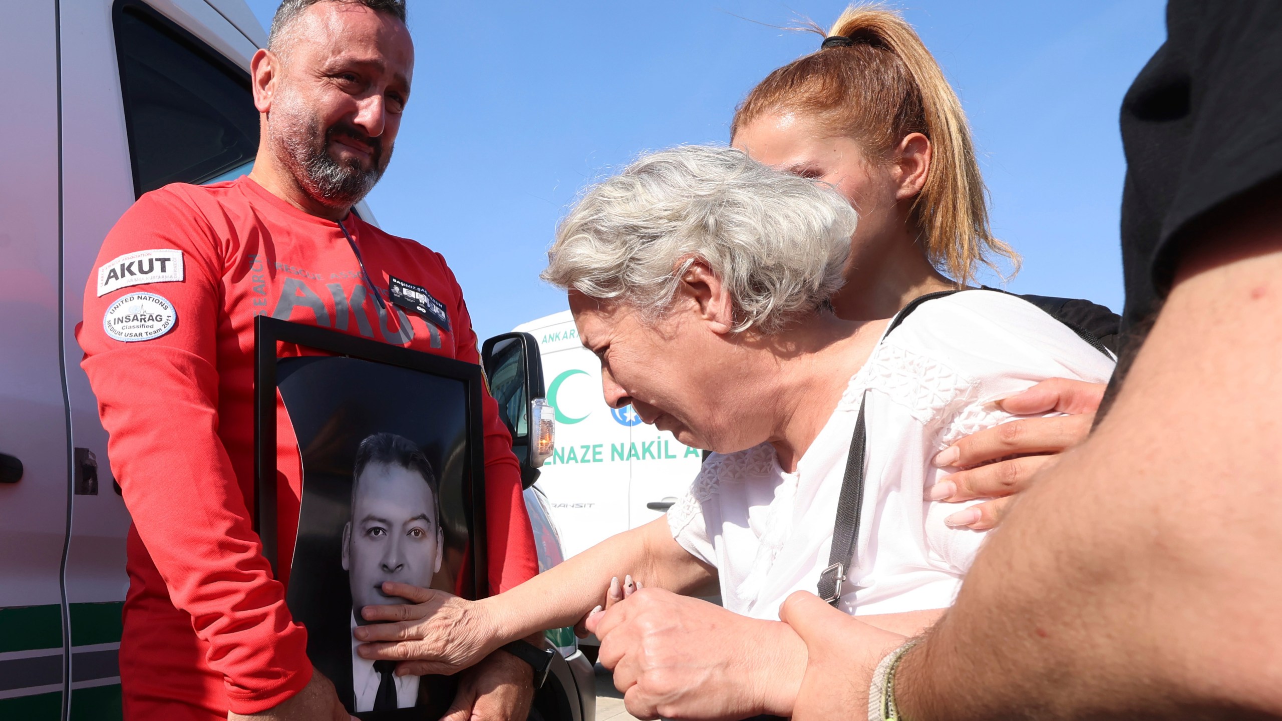 Relatives and friends mourn during the funeral of five rescue volunteers killed while battling a wildfire in northwestern Eskisehir province, in Ankara, Turkey, Thursday, July 24, 2025. (Yavuz Ozden/Dia Photo via AP)
