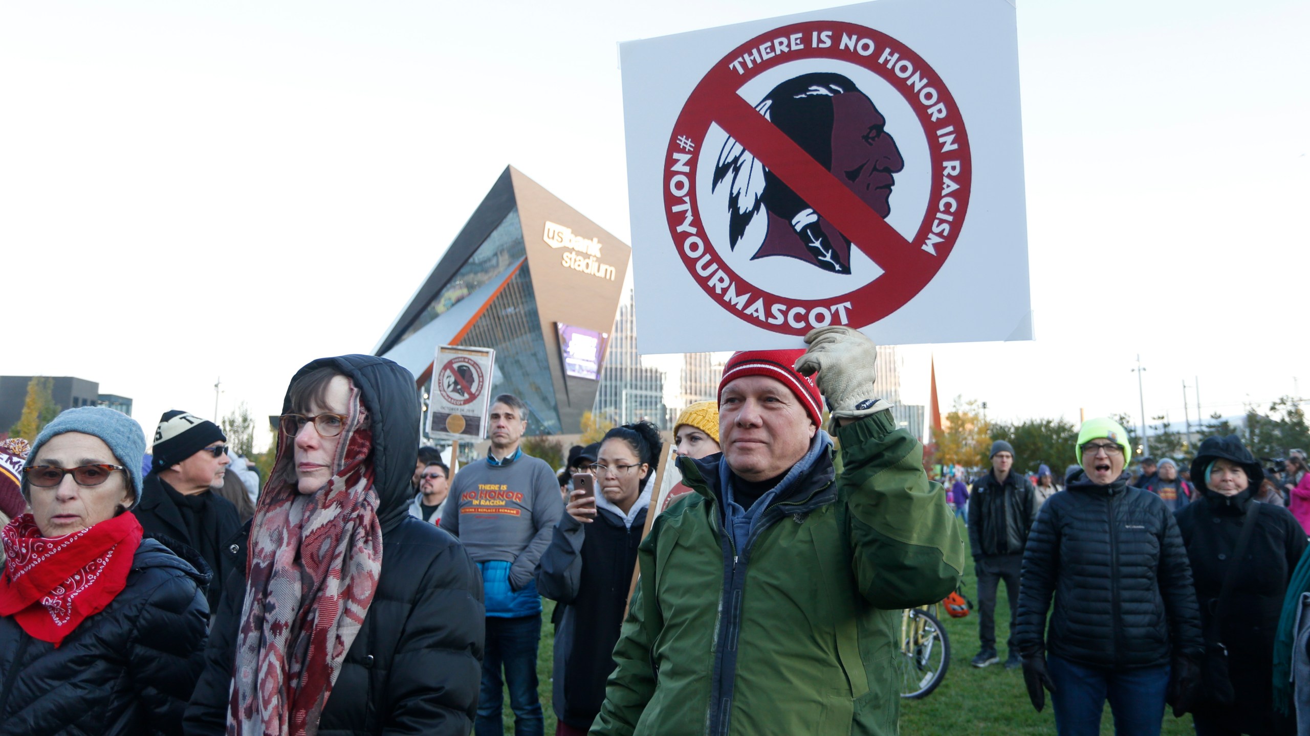 FILE - Native American leaders protest against the Redskins team name and logo outside U.S. Bank Stadium before an NFL football game between the Minnesota Vikings and the Washington Redskins in Minneapolis on Oct. 24, 2019. (AP Photo/Bruce Kluckhohn, File)