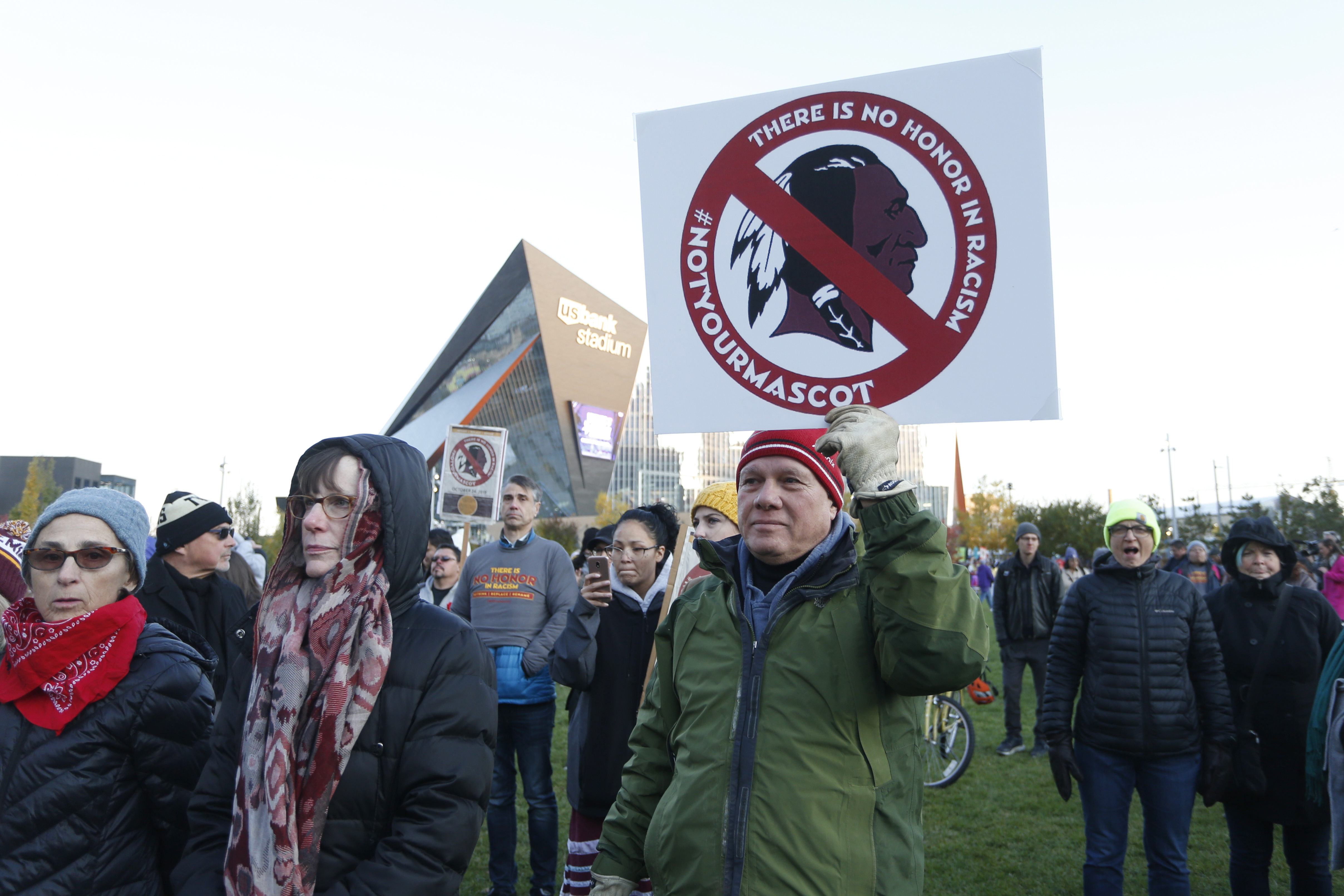 FILE - Native American leaders protest against the Redskins team name and logo outside U.S. Bank Stadium before an NFL football game between the Minnesota Vikings and the Washington Redskins in Minneapolis on Oct. 24, 2019. (AP Photo/Bruce Kluckhohn, File)