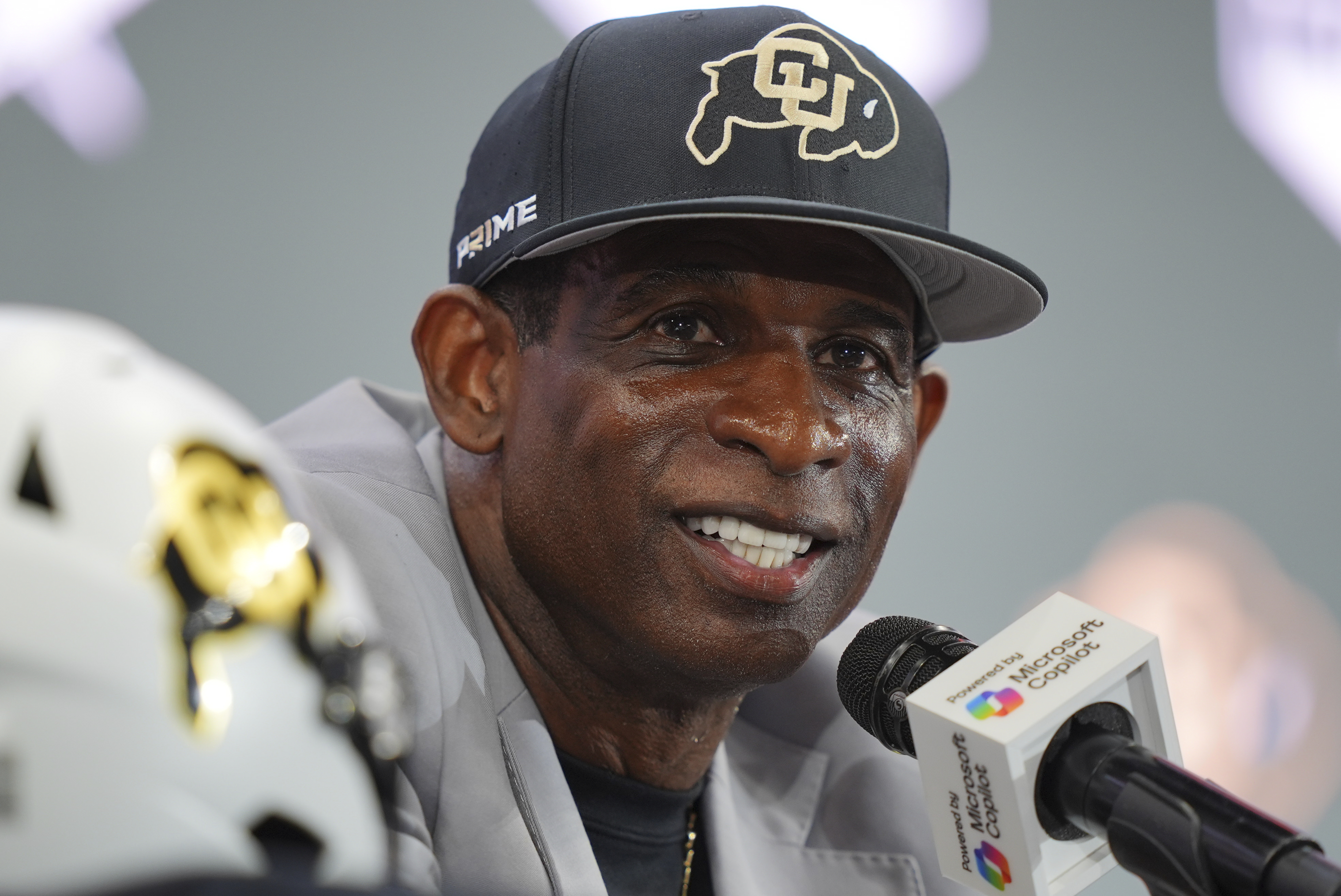 Colorado head coach Deion Sanders listens to a question during the Big 12 NCAA college football media day in Frisco, Texas, Wednesday, July 9, 2025. (AP Photo/LM Otero)