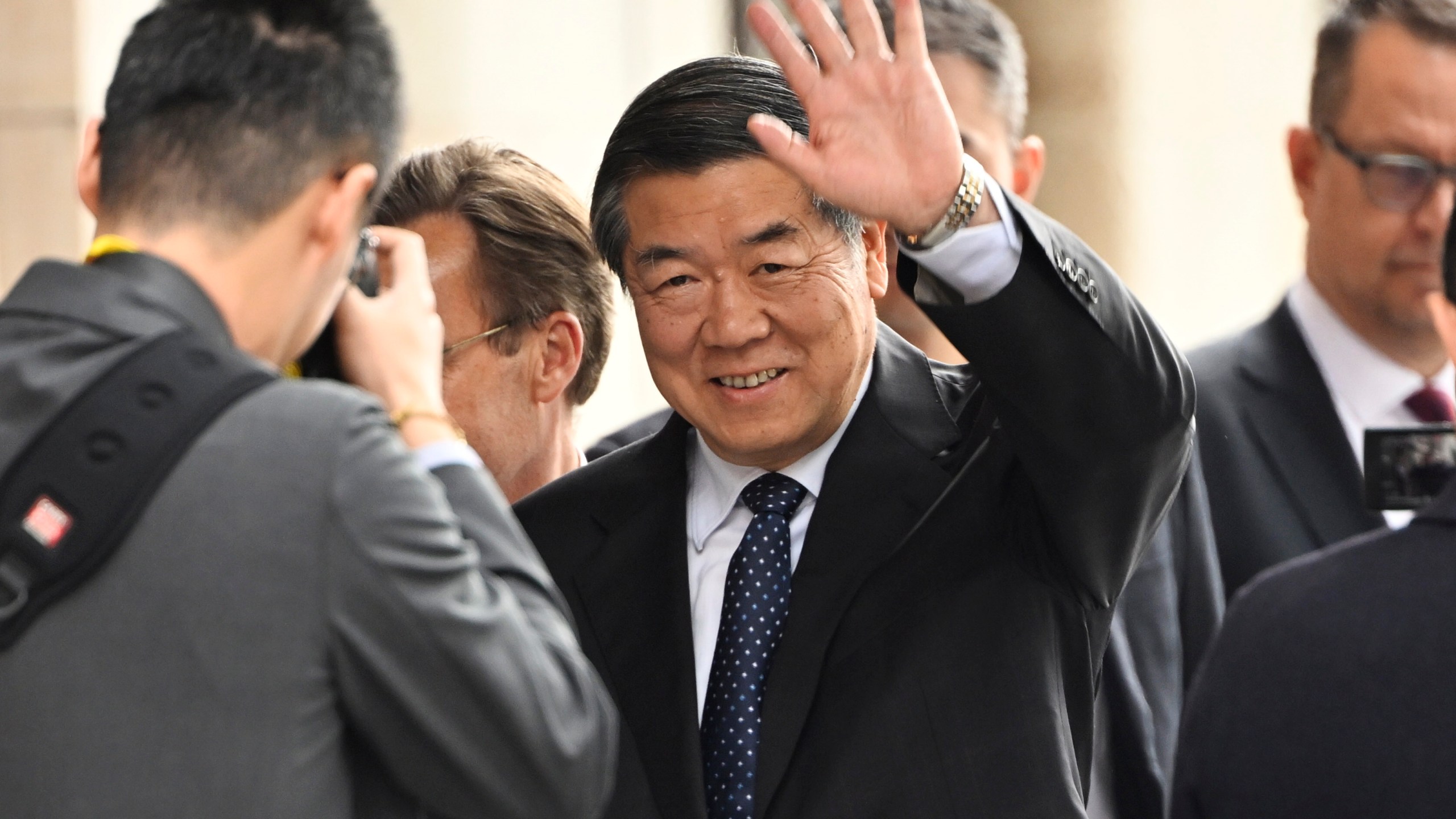 Chinese vice prime minister He Lifeng, center, waves as he arrives at Rosenbad before trade talks between the US and China in Stockholm, Sweden, July 28, 2025. (Fredrik Sandberg/TT News Agency via AP)