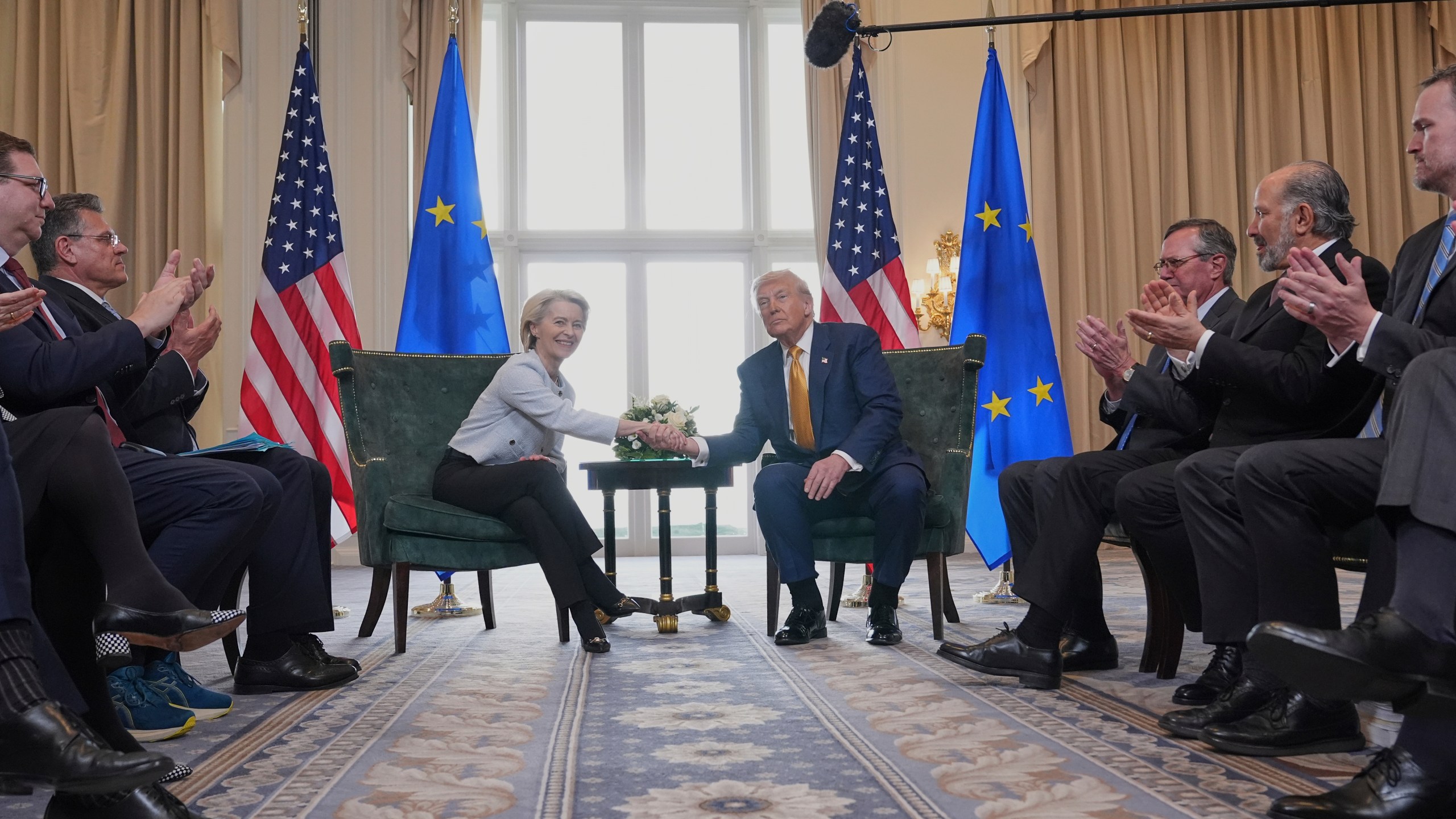 President Donald Trump and European Commission President Ursula von der Leyen shake hands after reaching a trade deal at the Trump Turnberry golf course in Turnberry, Scotland Sunday, July 27, 2025. (AP Photo/Jacquelyn Martin)