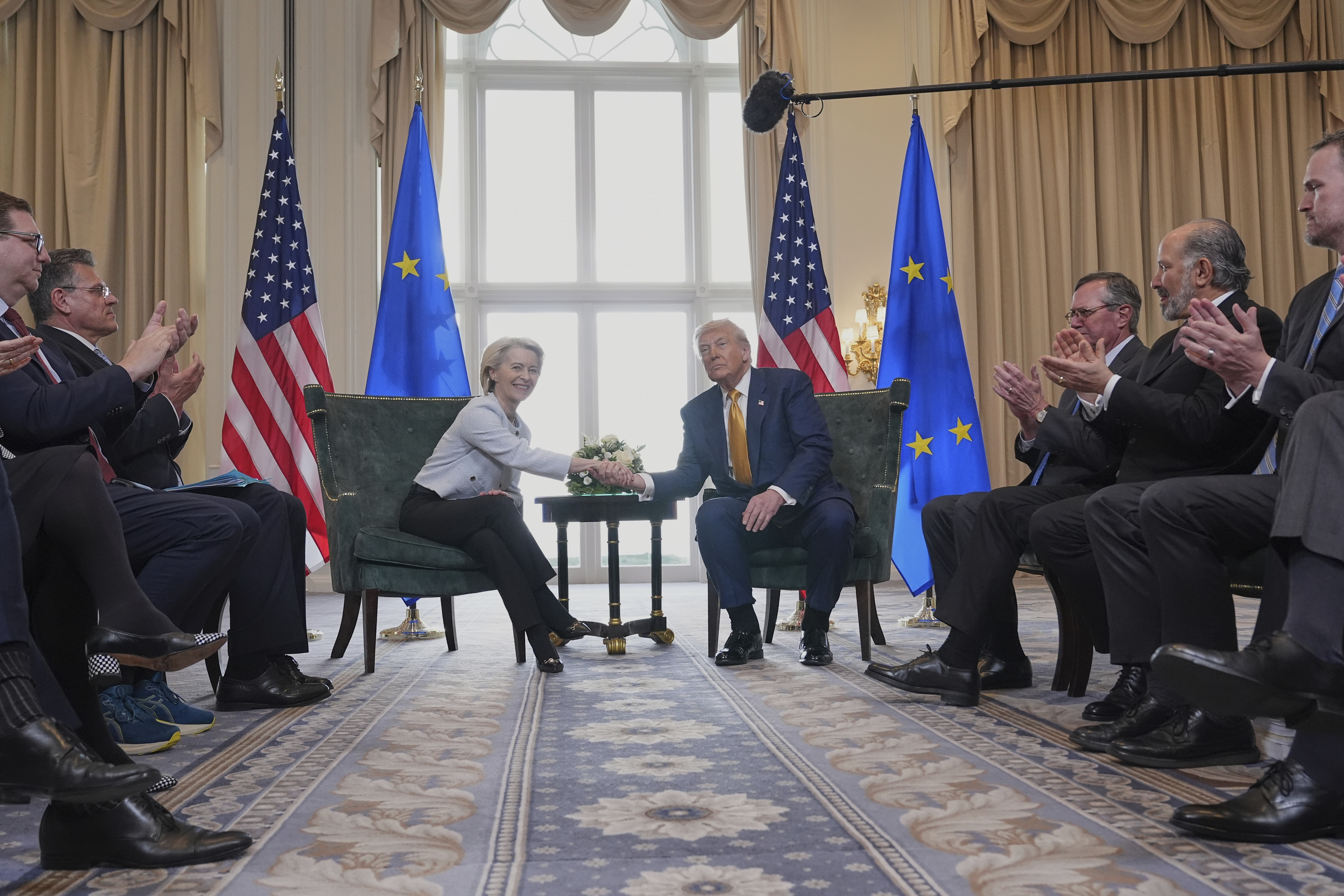 President Donald Trump and European Commission President Ursula von der Leyen shake hands after reaching a trade deal at the Trump Turnberry golf course in Turnberry, Scotland Sunday, July 27, 2025. (AP Photo/Jacquelyn Martin)