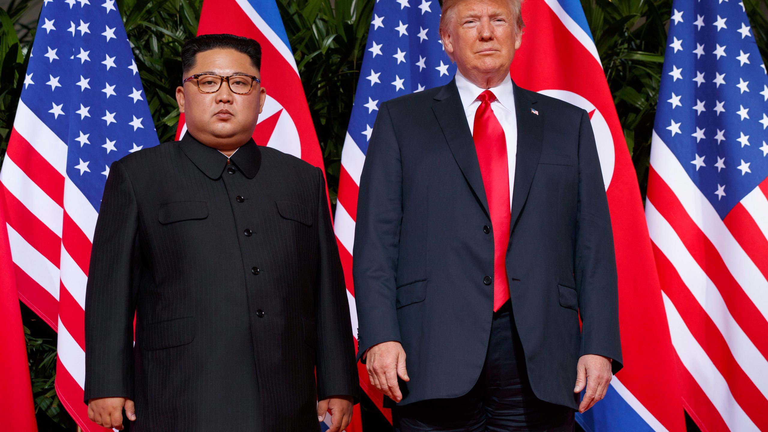 FILE - U.S. President Donald Trump, right, meets with North Korean leader Kim Jong Un on Sentosa Island, in Singapore, June 12, 2018. (AP Photo/Evan Vucci, File)