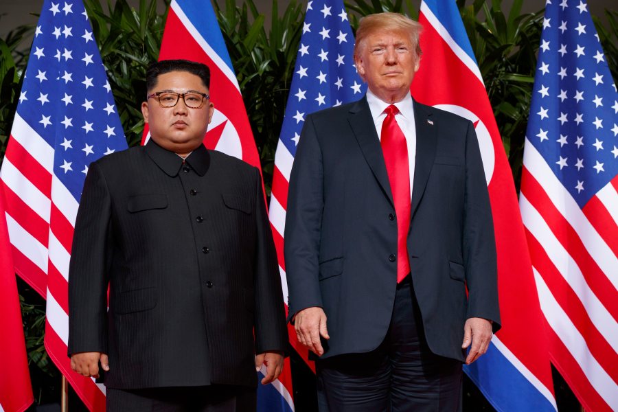 FILE - U.S. President Donald Trump, right, meets with North Korean leader Kim Jong Un on Sentosa Island, in Singapore, June 12, 2018. (AP Photo/Evan Vucci, File)