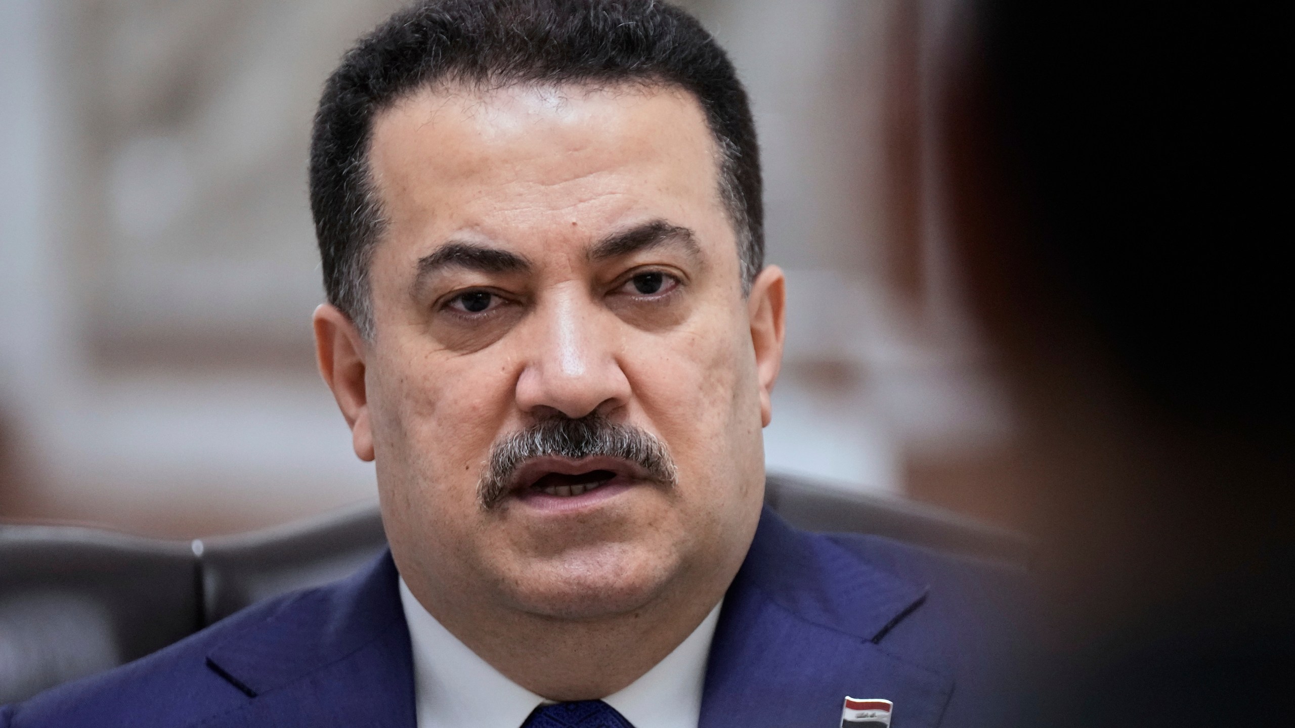 Iraq's Prime Minister Mohammed al-Sudani speaks during an interview with The Associated Press in Baghdad on Monday, July 28, 2025. (AP Photo/Hadi Mizban)