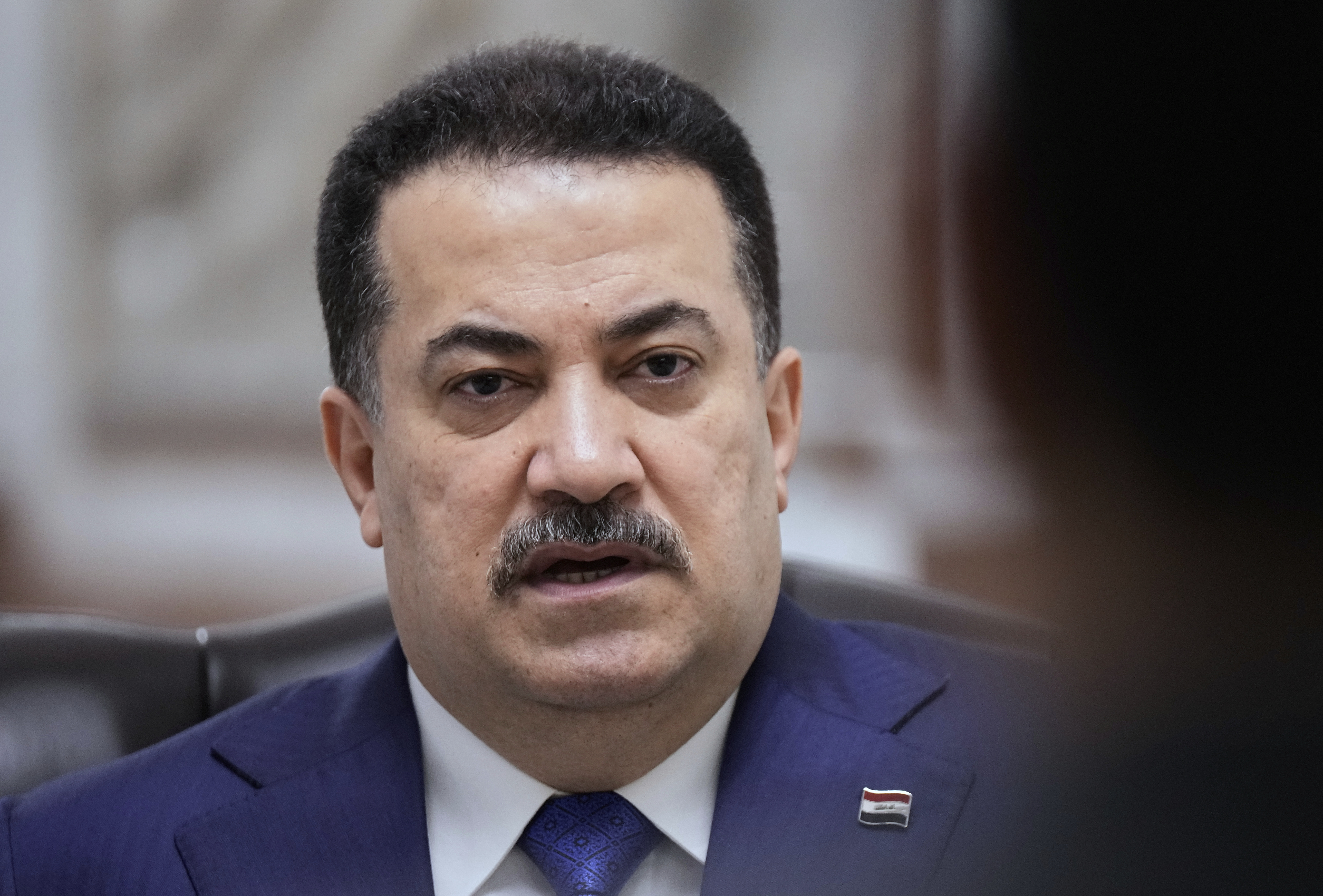 Iraq's Prime Minister Mohammed al-Sudani speaks during an interview with The Associated Press in Baghdad on Monday, July 28, 2025. (AP Photo/Hadi Mizban)