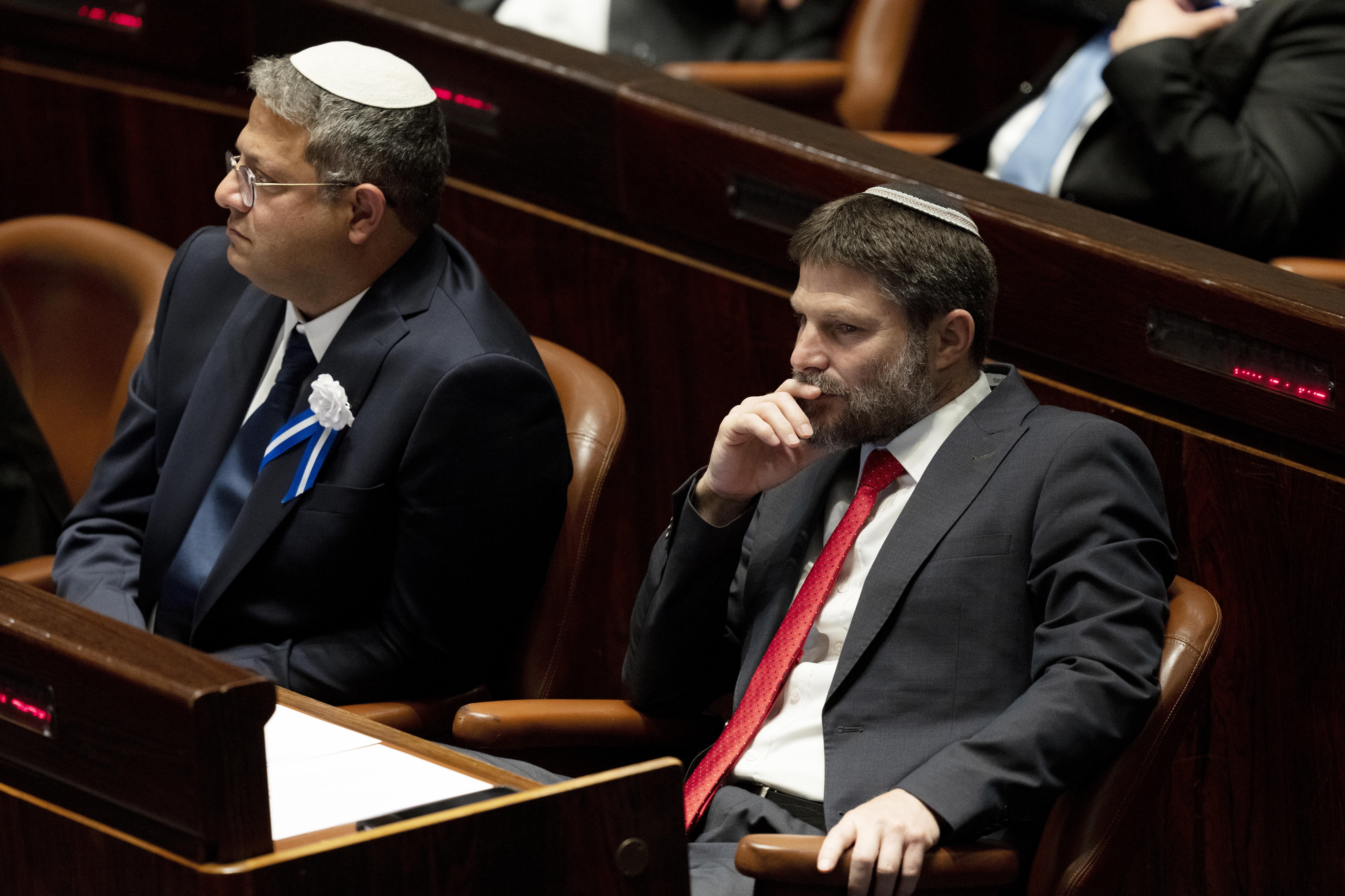 FILE -Far-right Israeli lawmakers Itamar Ben Gvir, center, and Bezalel Smotrich, right, attend the swearing-in ceremony for Israel's parliament, at the Knesset, in Jerusalem, Nov. 15, 2022. (AP Photo/ Maya Alleruzzo, Pool, File)