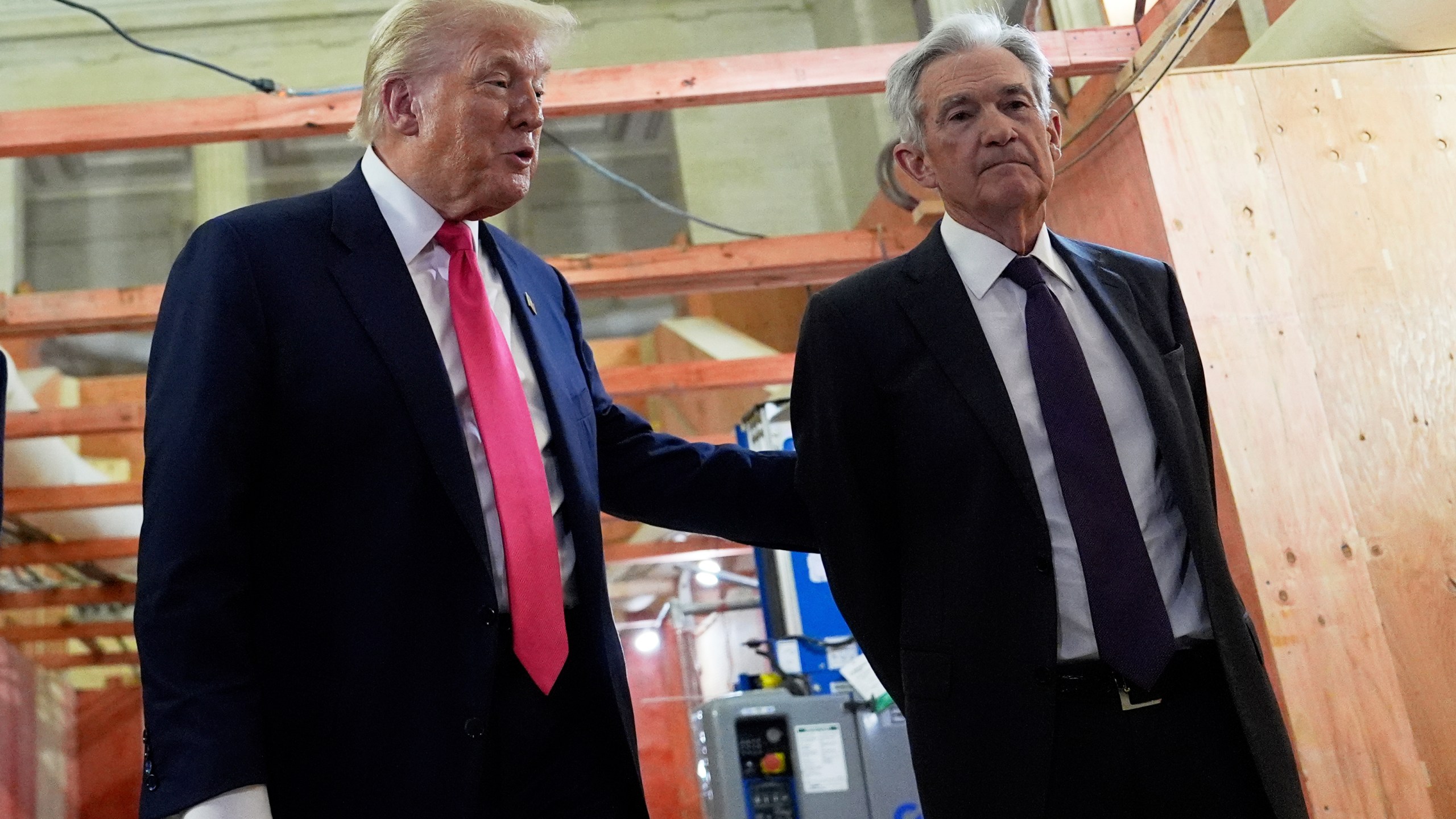 President Donald Trump, left, speaks with Federal Reserve Chairman Jerome Powell during a visit to the Federal Reserve, Thursday, July 24, 2025, in Washington. (AP Photo/Julia Demaree Nikhinson)