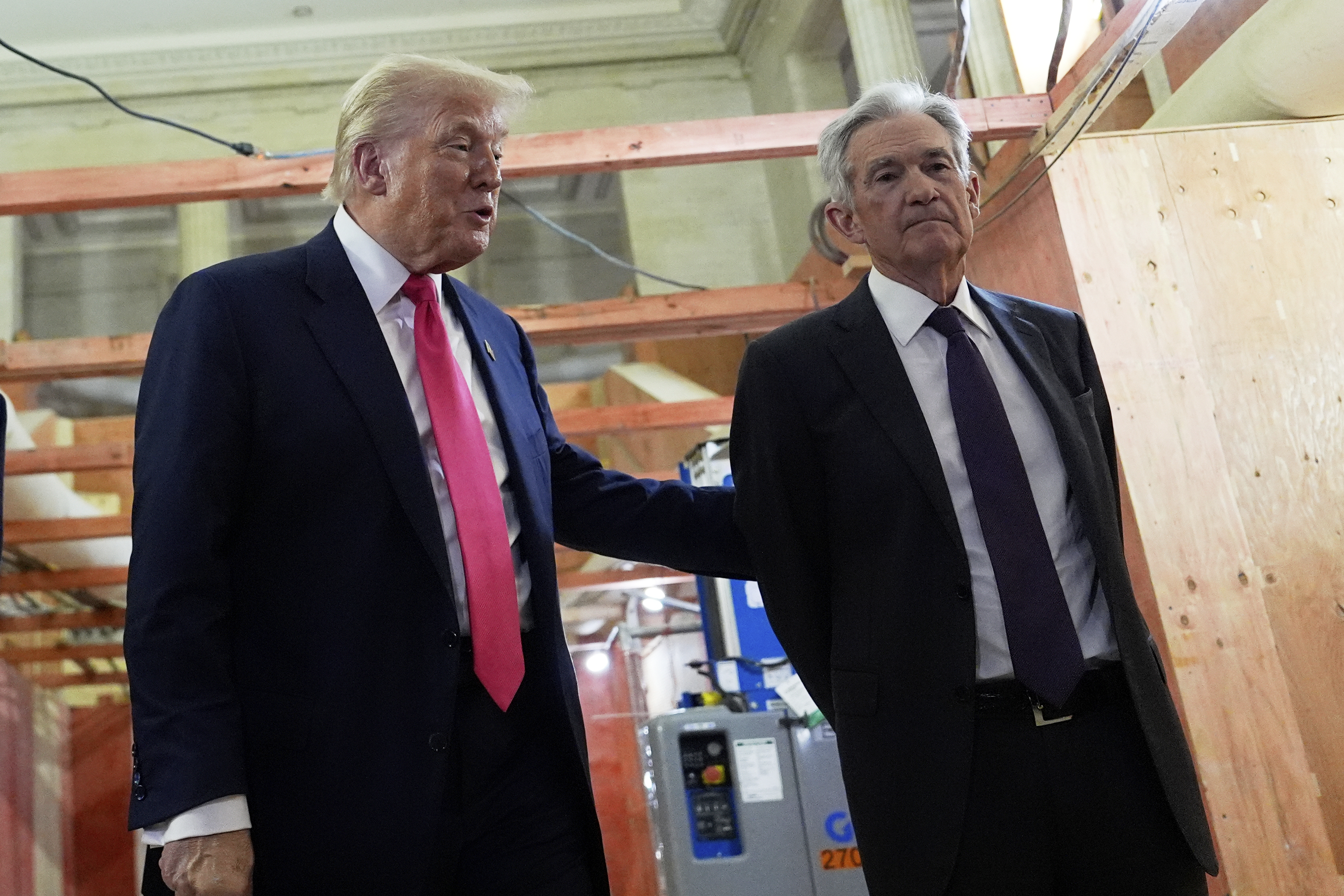 President Donald Trump, left, speaks with Federal Reserve Chairman Jerome Powell during a visit to the Federal Reserve, Thursday, July 24, 2025, in Washington. (AP Photo/Julia Demaree Nikhinson)