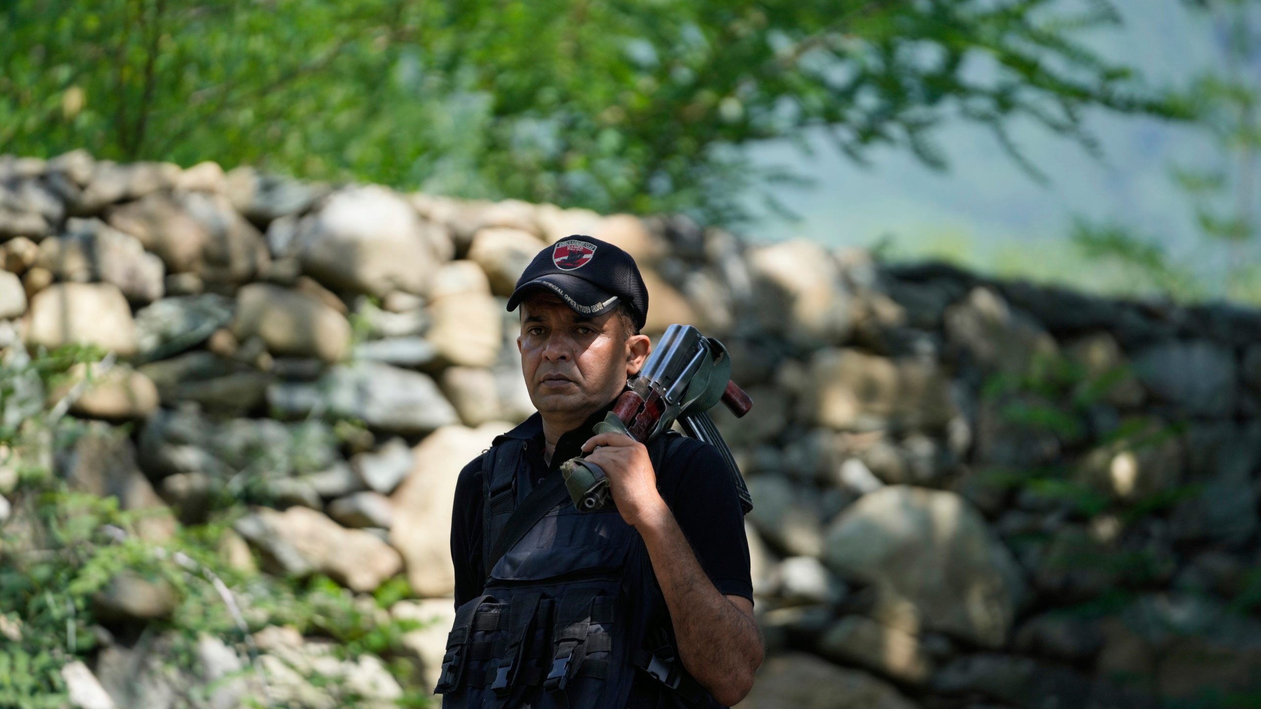 Jammu and Kashmir Special Operation Group (SOG) personnel guard near the site of a gun battle on the outskirts of Srinagar, Indian controlled Kashmir, Monday, July 28, 2025. (AP Photo/Mukhtar Khan)