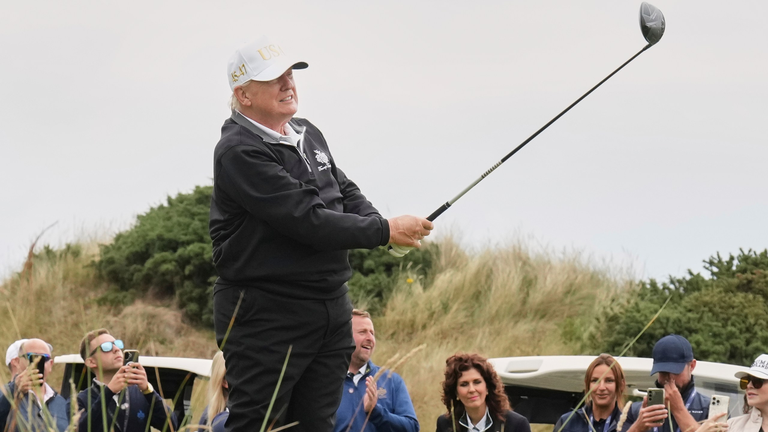 President Donald Trump tees off during the opening ceremony for the Trump International Golf Links golf course, near Aberdeen, Scotland, Tuesday, July 29, 2025. (AP Photo/Jacquelyn Martin)