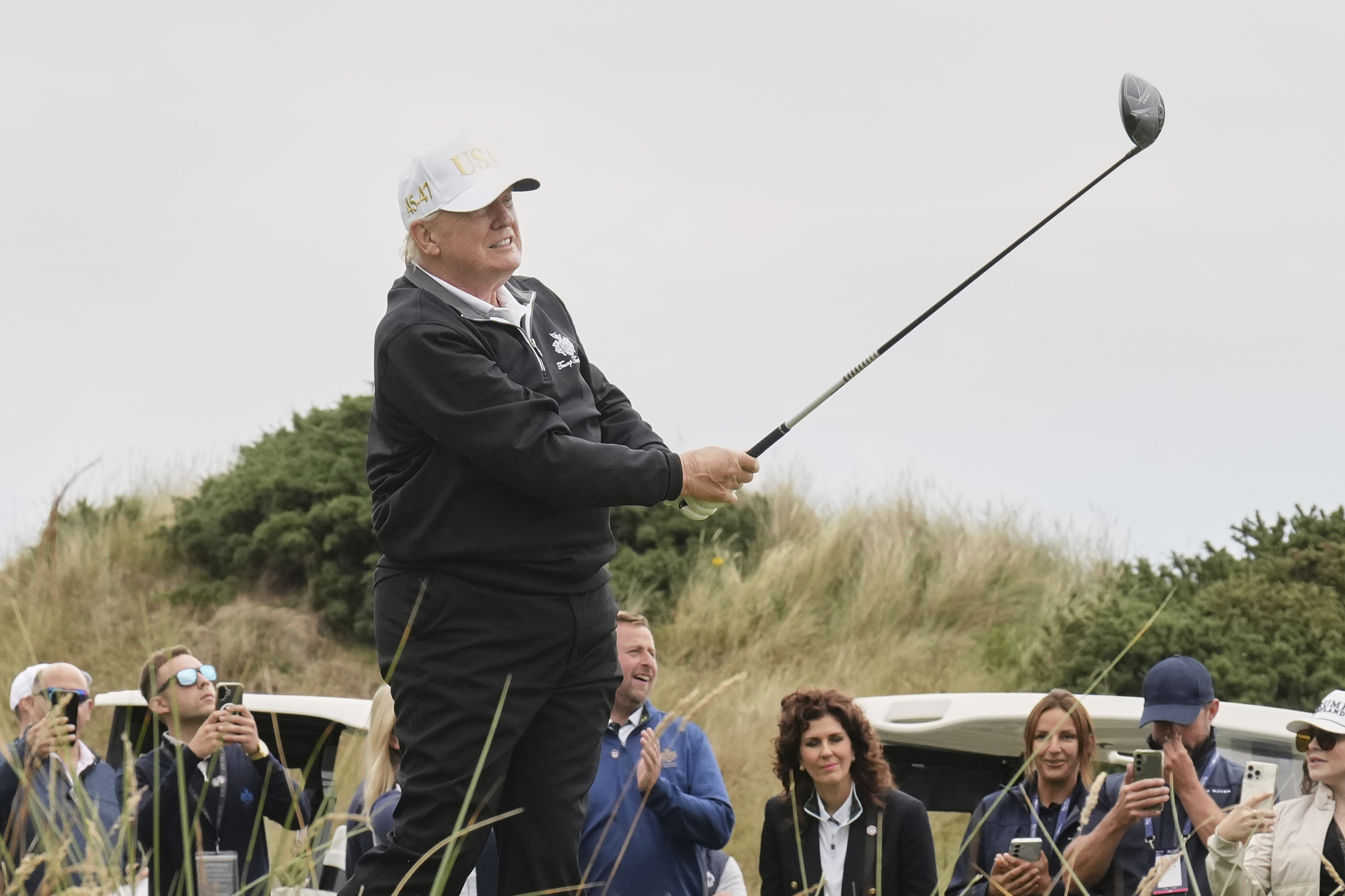 President Donald Trump tees off during the opening ceremony for the Trump International Golf Links golf course, near Aberdeen, Scotland, Tuesday, July 29, 2025. (AP Photo/Jacquelyn Martin)