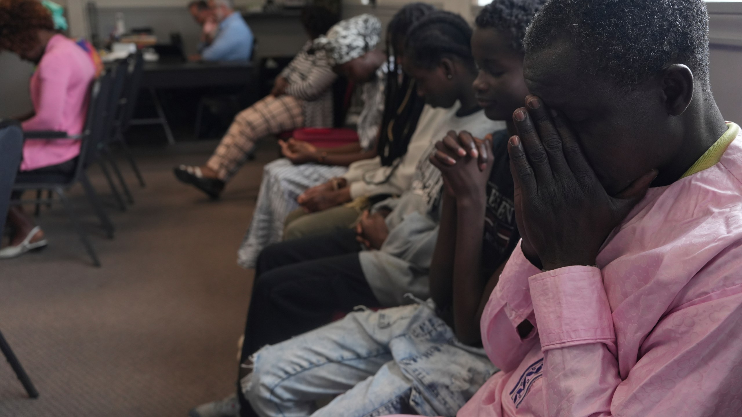 Worshippers pray during service at The Reformed Baptist Church in Saint Jerome, Quebec, Sunday, June 29, 2025. (AP Photo/Luis Andres Henao)