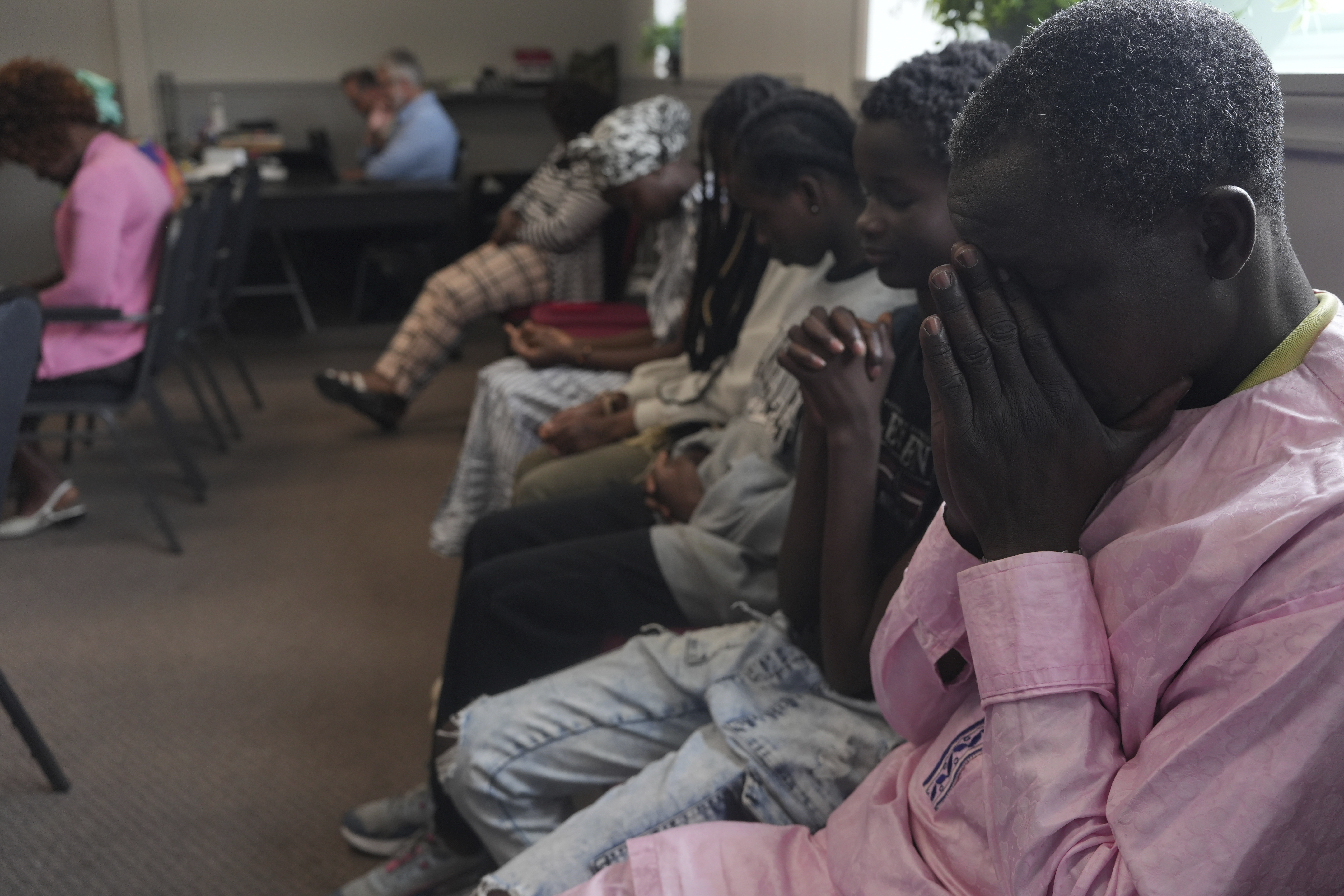 Worshippers pray during service at The Reformed Baptist Church in Saint Jerome, Quebec, Sunday, June 29, 2025. (AP Photo/Luis Andres Henao)