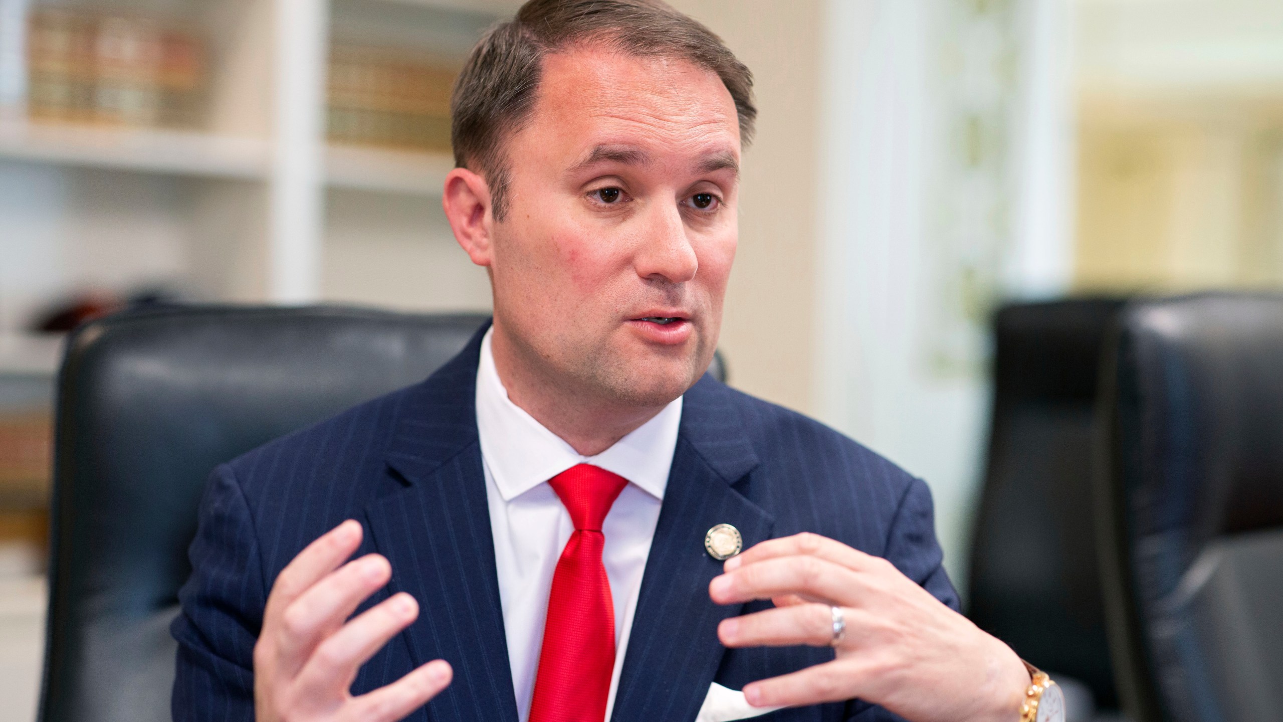 FILE - Virginia Attorney General Jason Miyares speaks during an interview at the Office of the Attorney General in Richmond, Va., Tuesday, May 9, 2023. (AP Photo/Ryan M. Kelly, file)