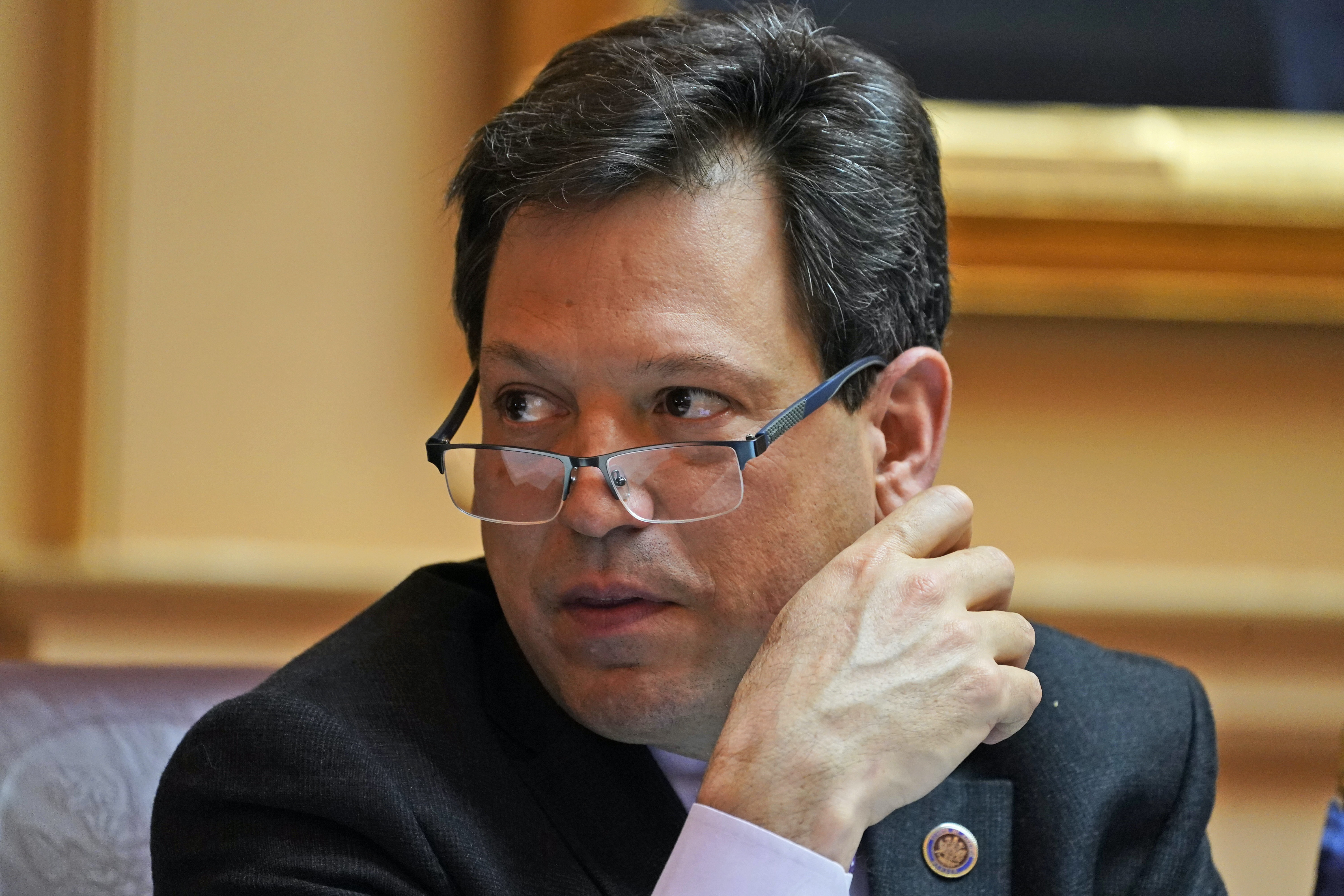 FILE - Virginia state Sen. Scott Surovell, D-Fairfax, listens to debate during the Senate session at the Capitol, March 10, 2022, in Richmond, Va. (AP Photo/Steve Helber, File)