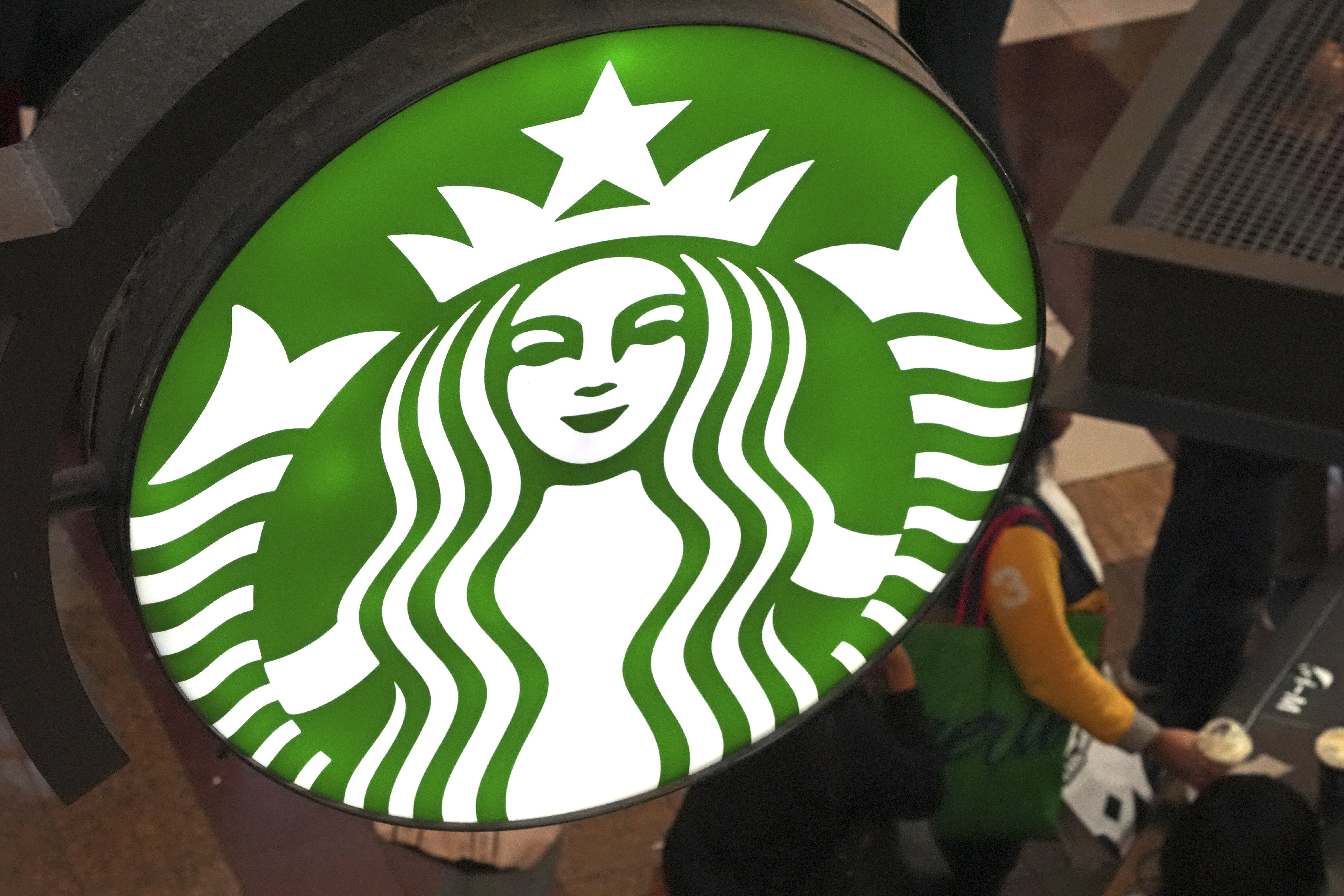 FILE - This is the Starbucks sign on Black Friday shoppers line at a Starbucks kiosk in the Walden Galleria in Buffalo, NY., Friday, Nov. 29, 2024. (AP Photo/Gene J. Puskar, File)