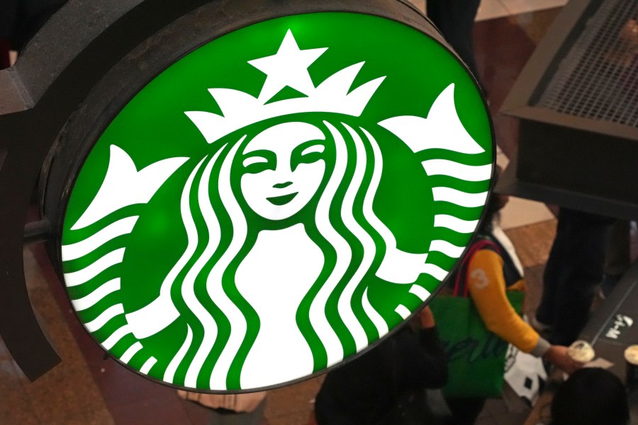 FILE - This is the Starbucks sign on Black Friday shoppers line at a Starbucks kiosk in the Walden Galleria in Buffalo, NY., Friday, Nov. 29, 2024. (AP Photo/Gene J. Puskar, File)
